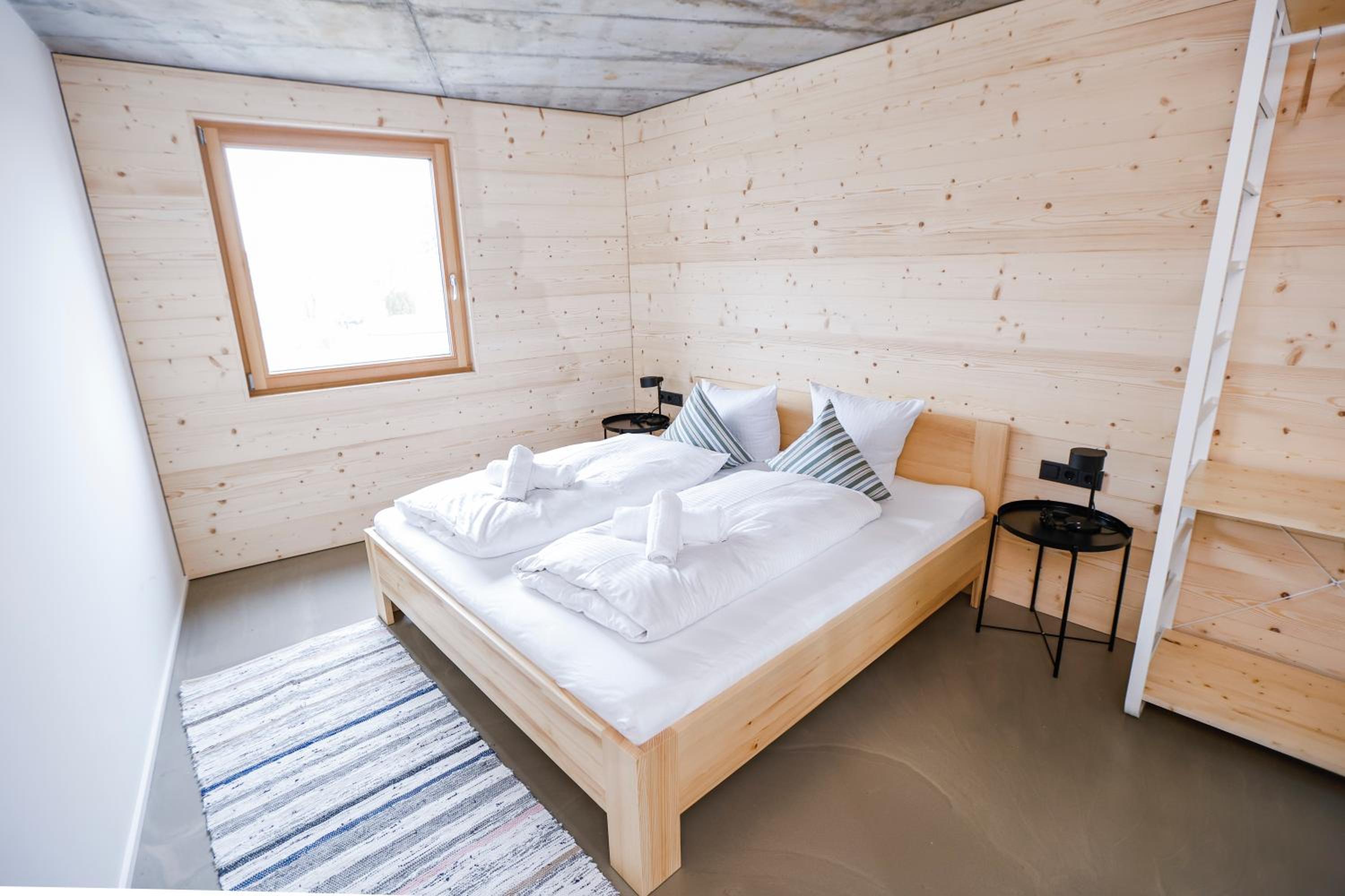 BOUTIQUE APARTMENTS LUSTENAU Nachhaltige Kühlung über Erdsonde und Fussbodenkühlung
