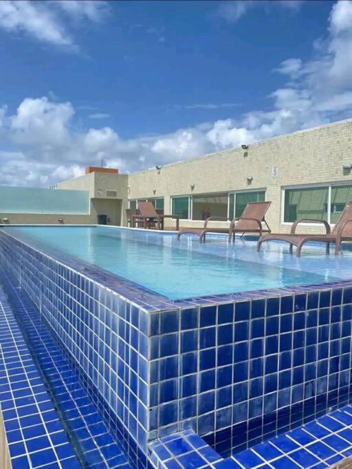 Flat Bello Plaza - piscina com vista da orla