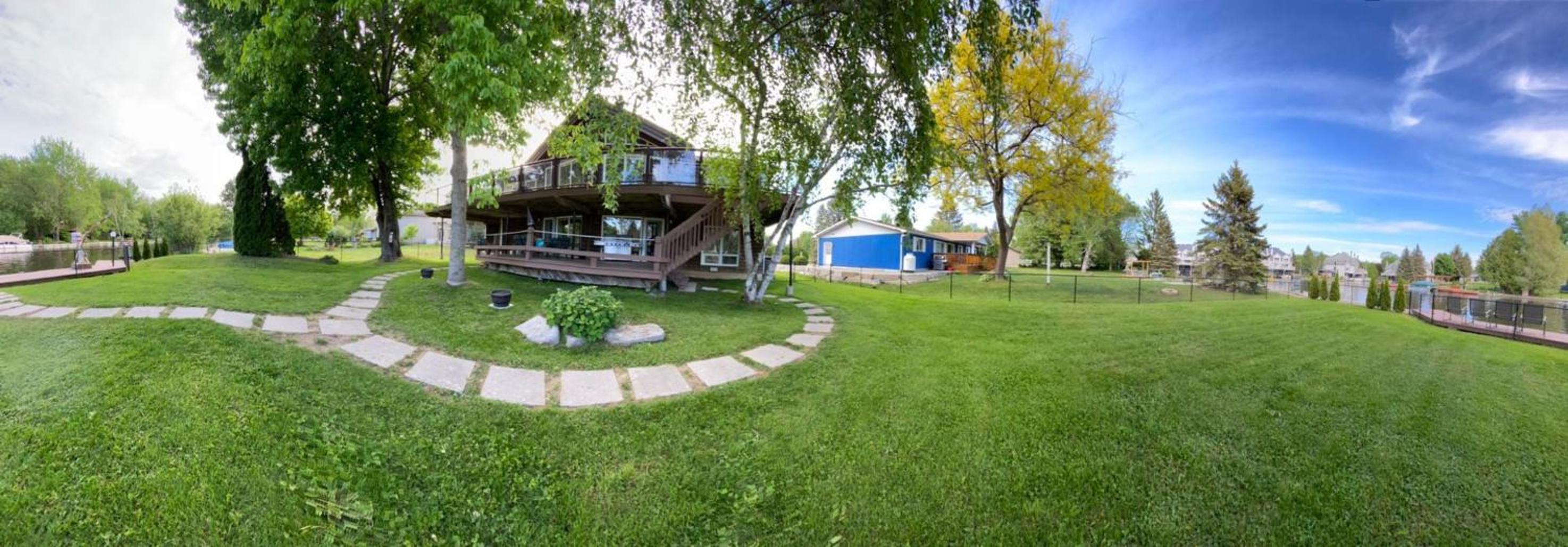 Waterfront Cottage 4 BD with Outdoor Dining, Fire Pite by GLOBALSTAY