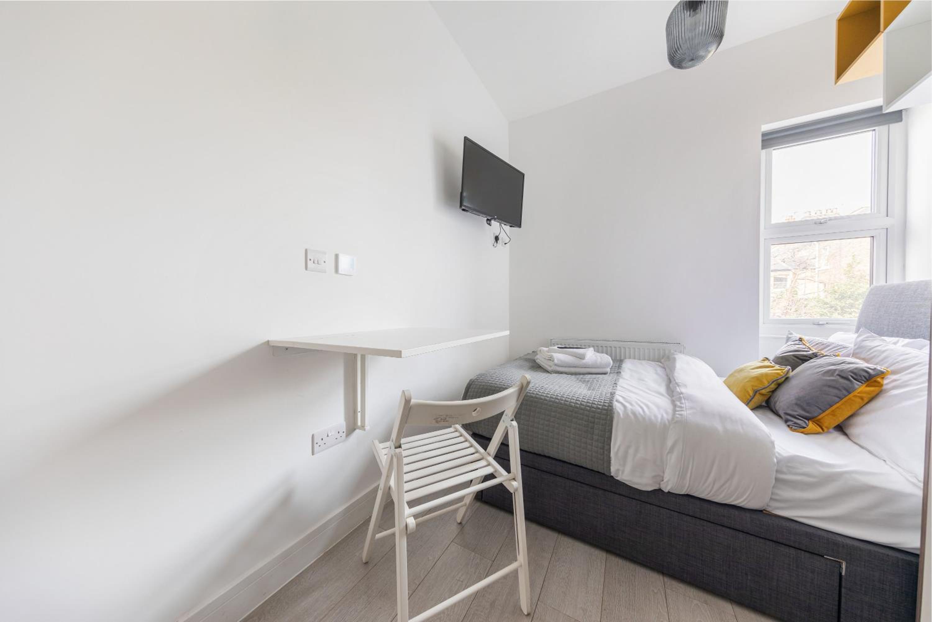 Functional Budget Stay with Wi-Fi and Laundry Facilities near Tube Station