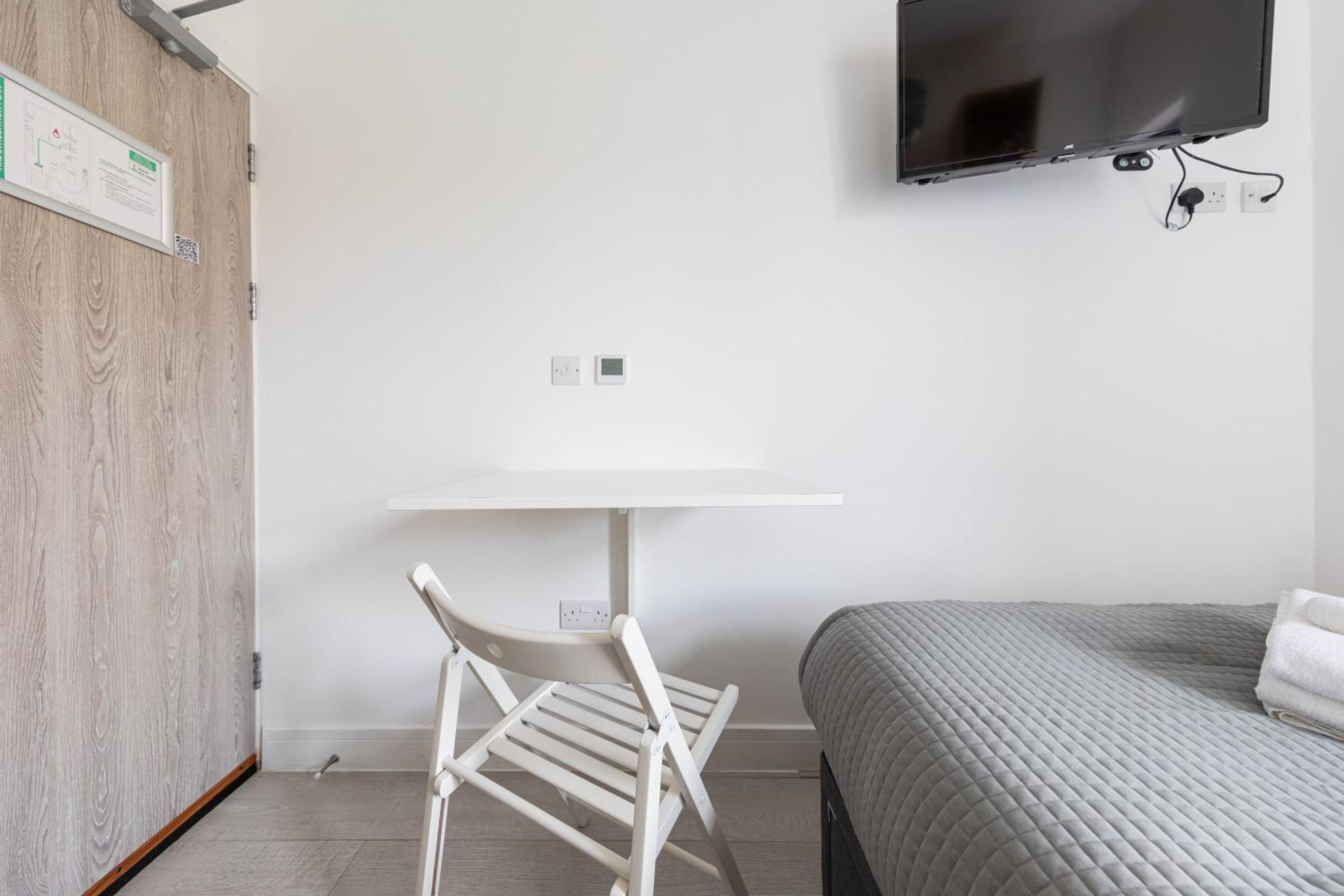 Functional Budget Stay with Wi-Fi and Laundry Facilities near Tube Station