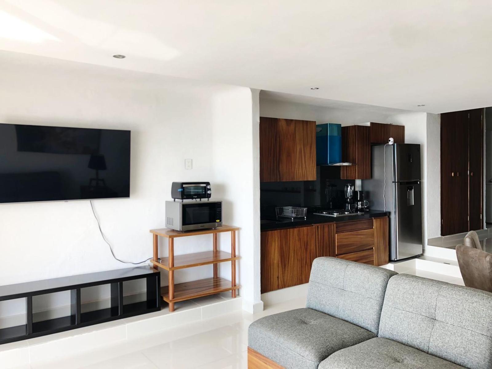INCREIBLE DEPARTAMENTO A PIE DE PLAYA EN MANZANILLO, COMPLETAMENTE NUEVO