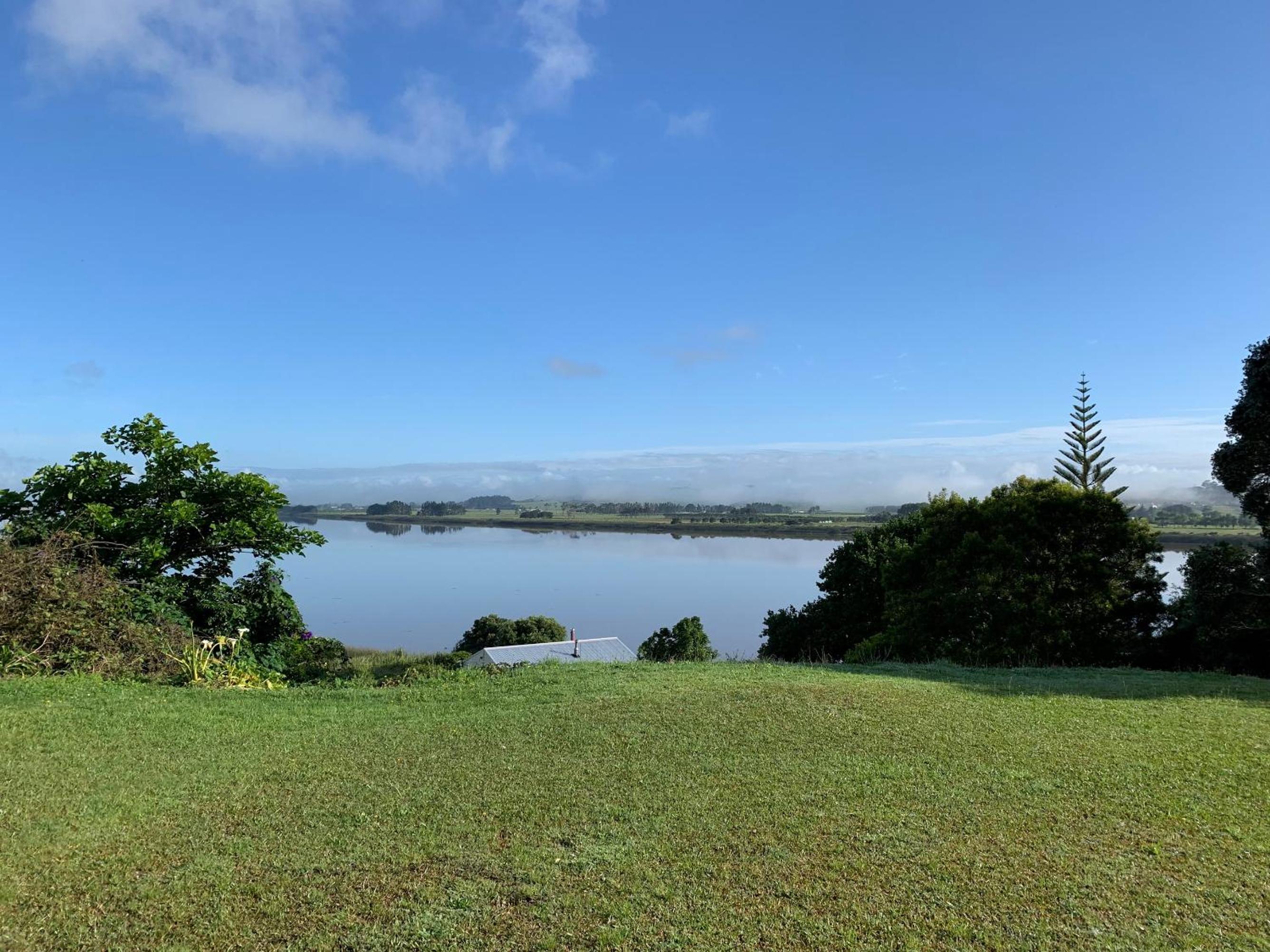 Peaceful Riverfront cottage in small northland town view 4