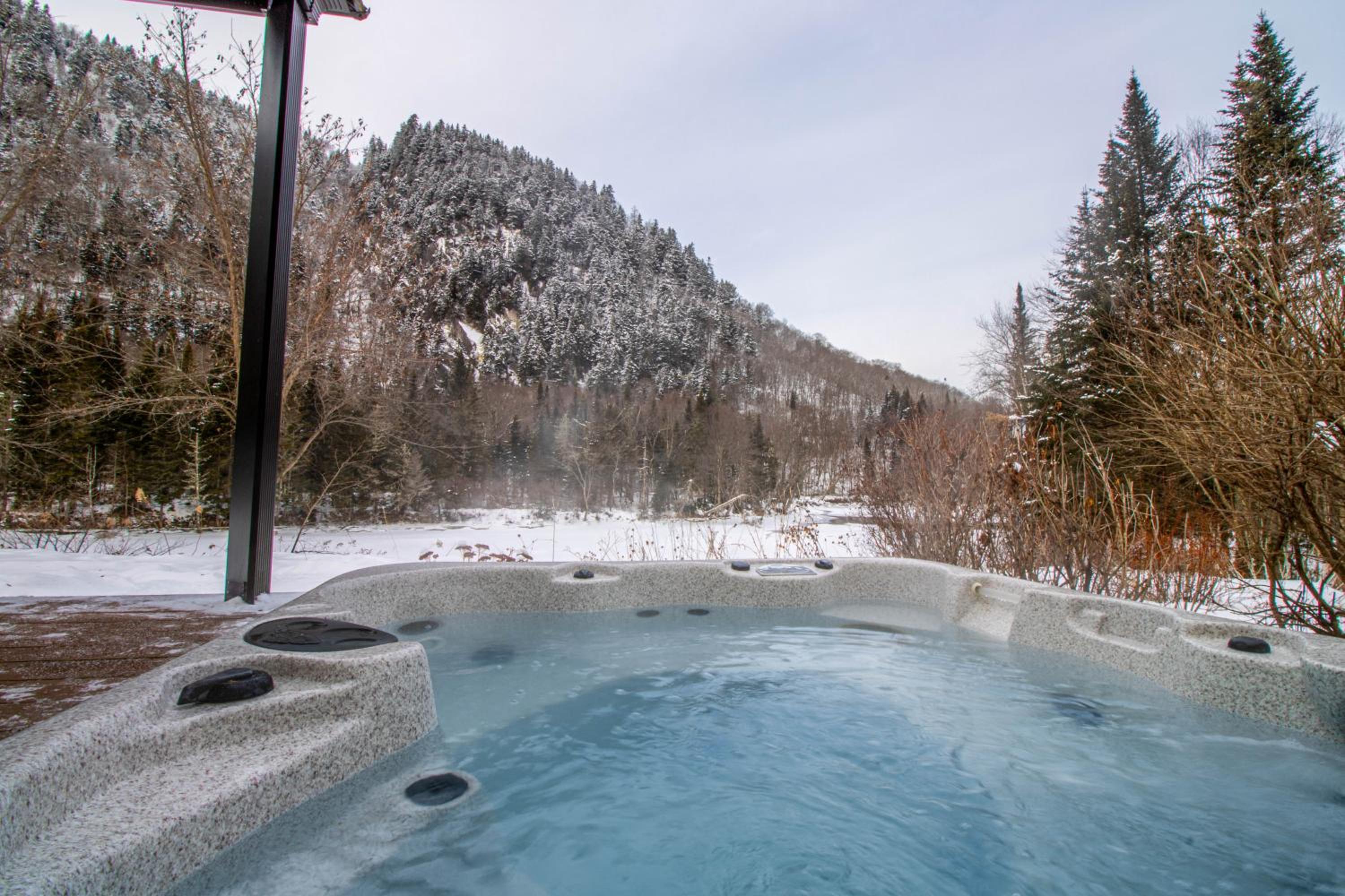 Tranquil Riverfront Chalet with Hot Tub