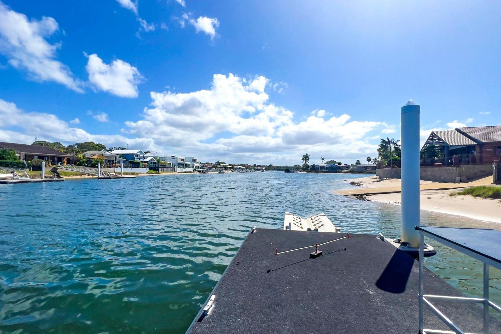 4 bedroom with large water frontage and pool, reverse air conditioning