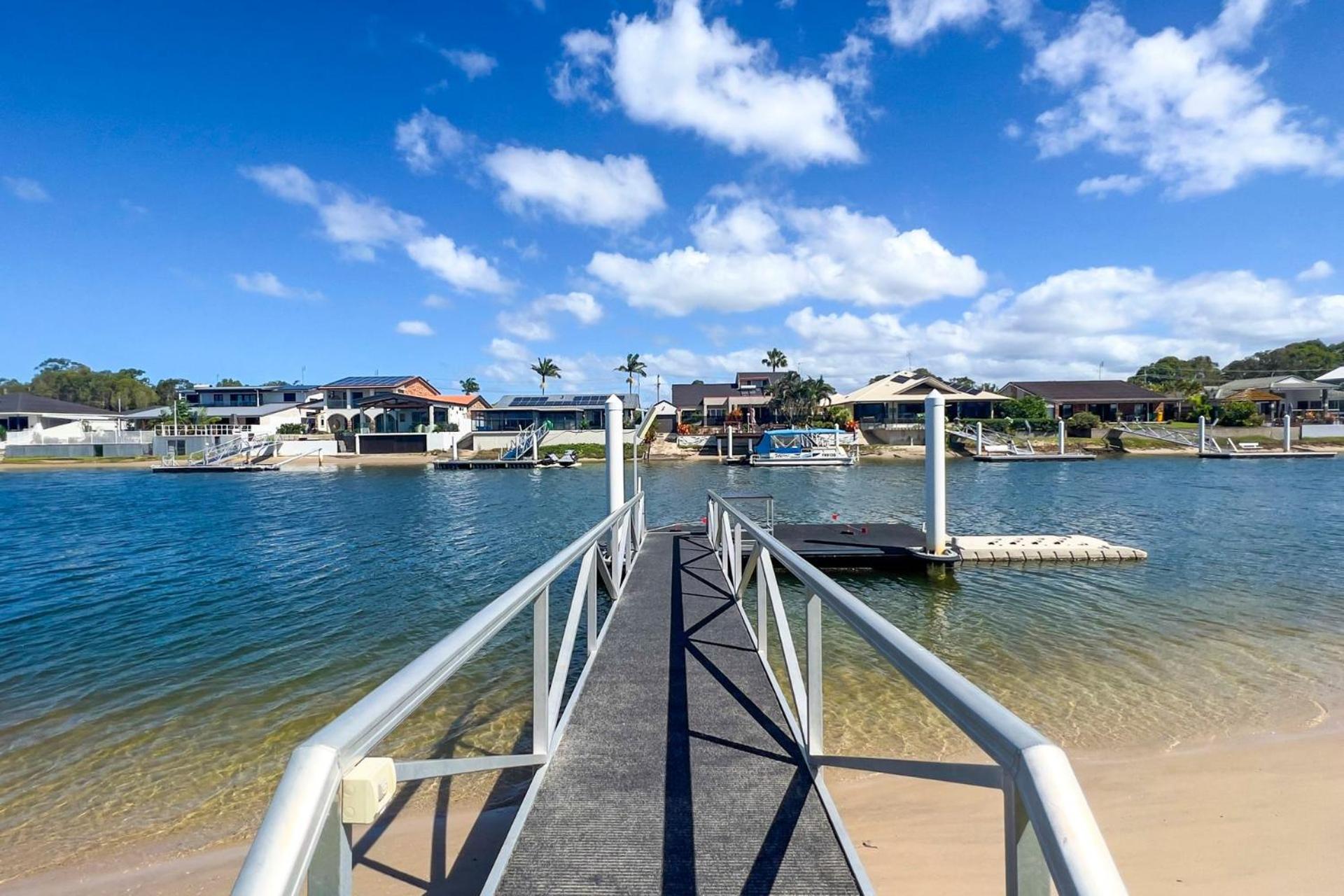4 bedroom with large water frontage and pool, reverse air conditioning