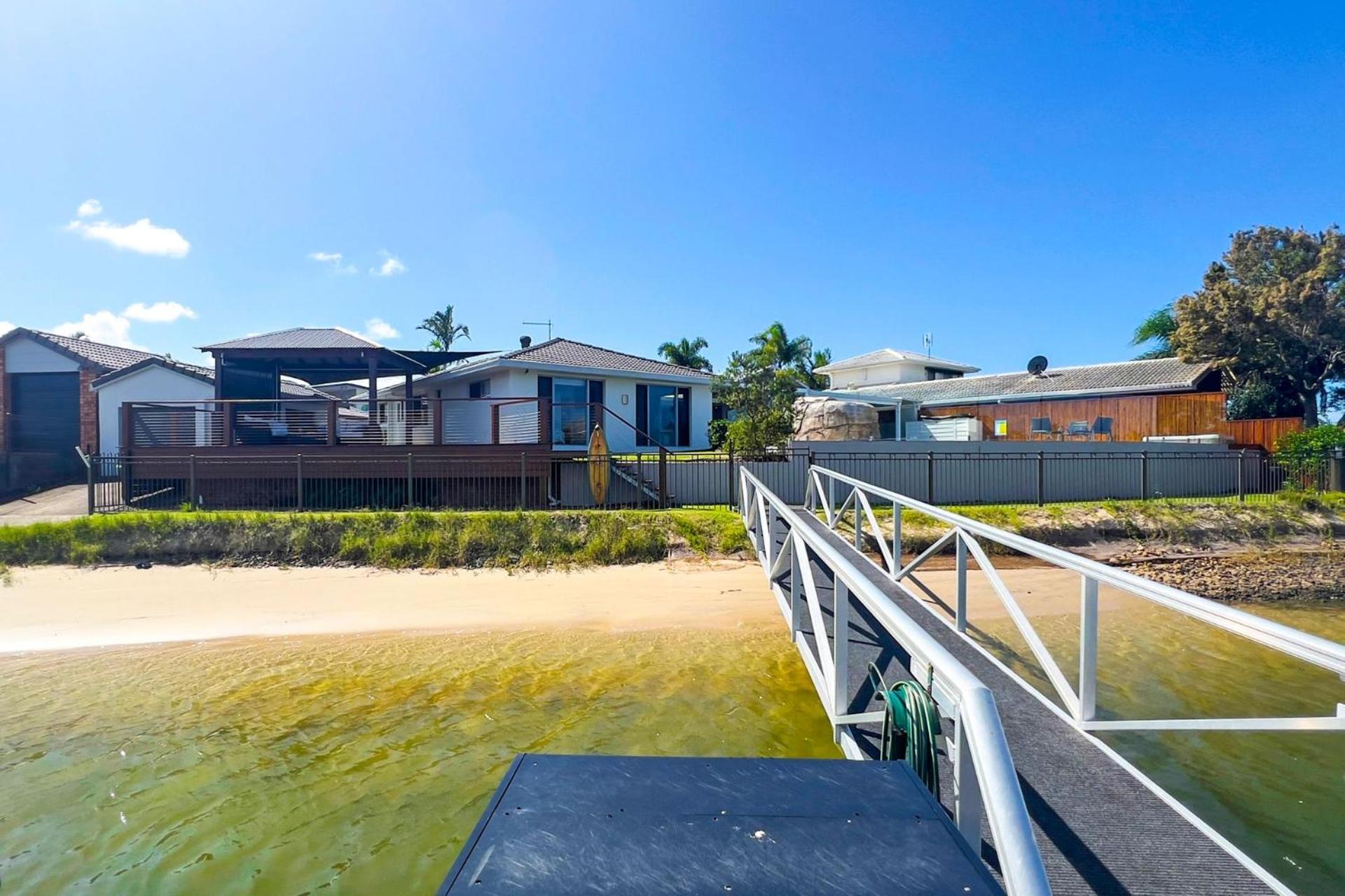4 bedroom with large water frontage and pool, reverse air conditioning