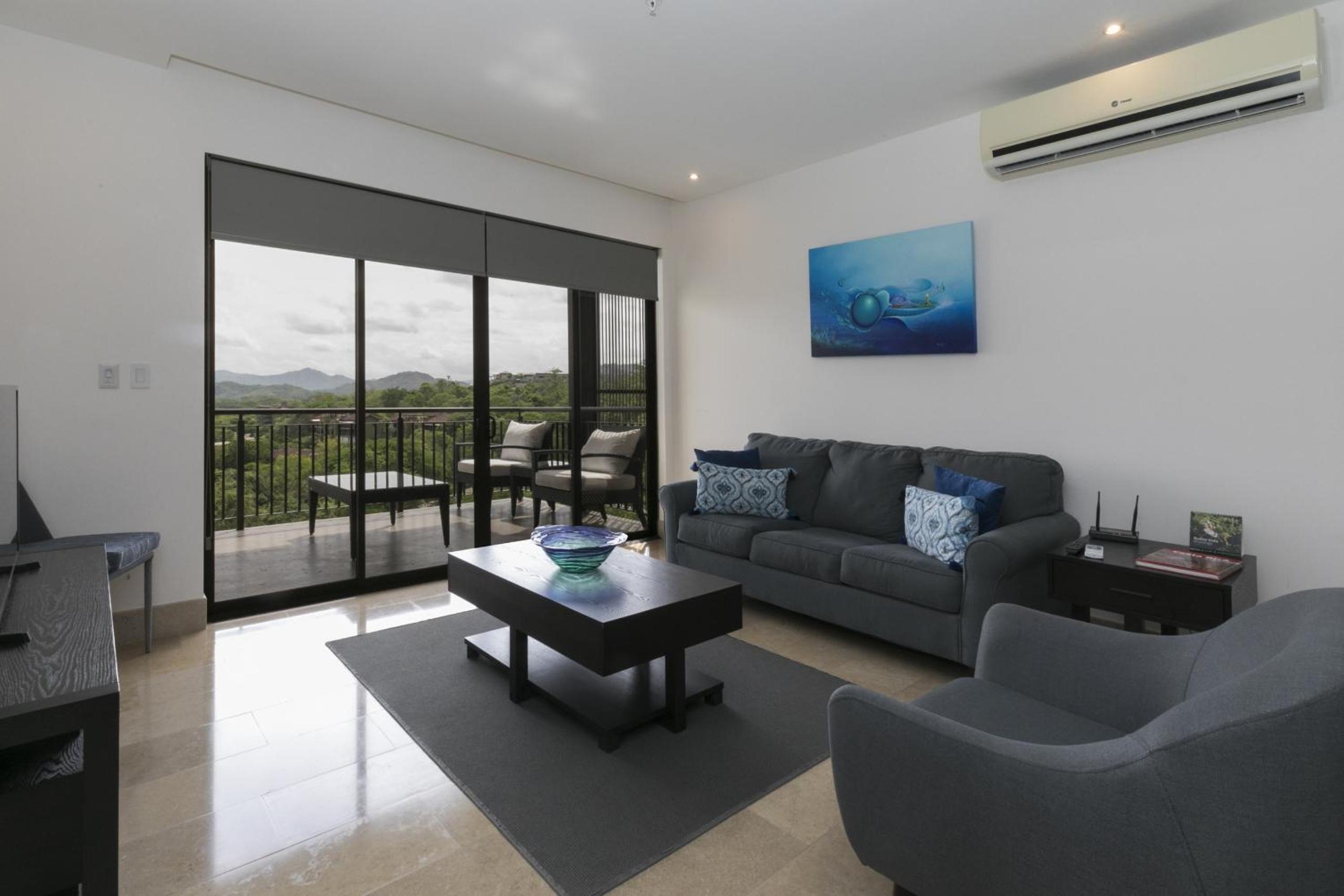Cozy 1BR Condo with Partial Ocean View - Roble Sabana - Reserva Conchall