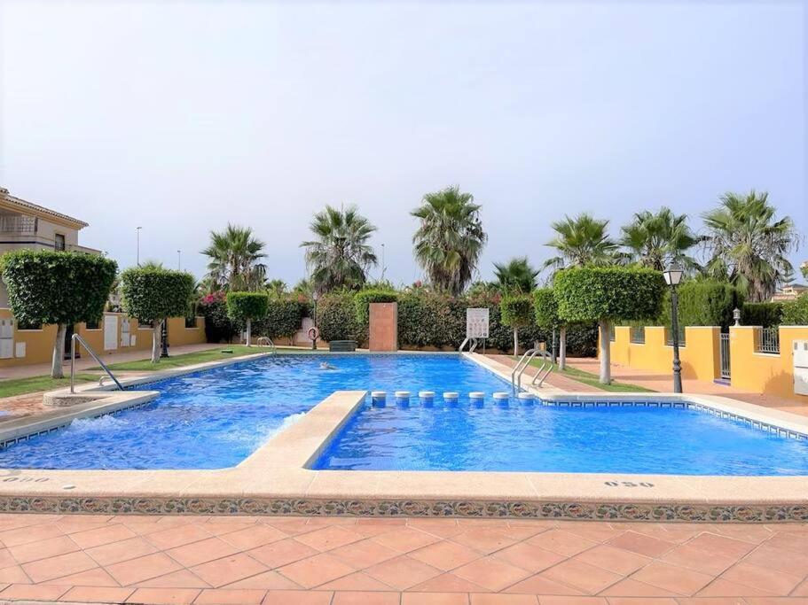 Beautiful 3 Bed Townhouse with landscaped communal pool area