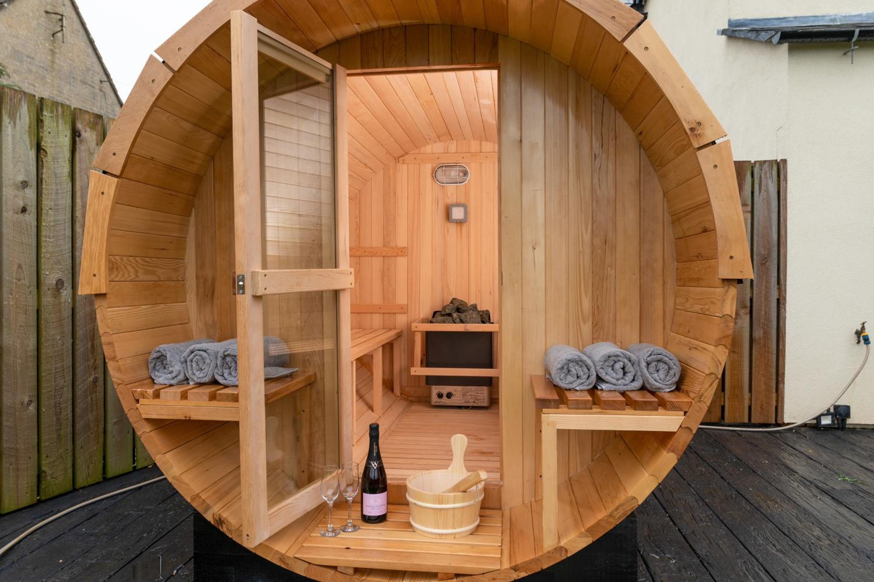Designer Cotswold post house with external sauna view 2