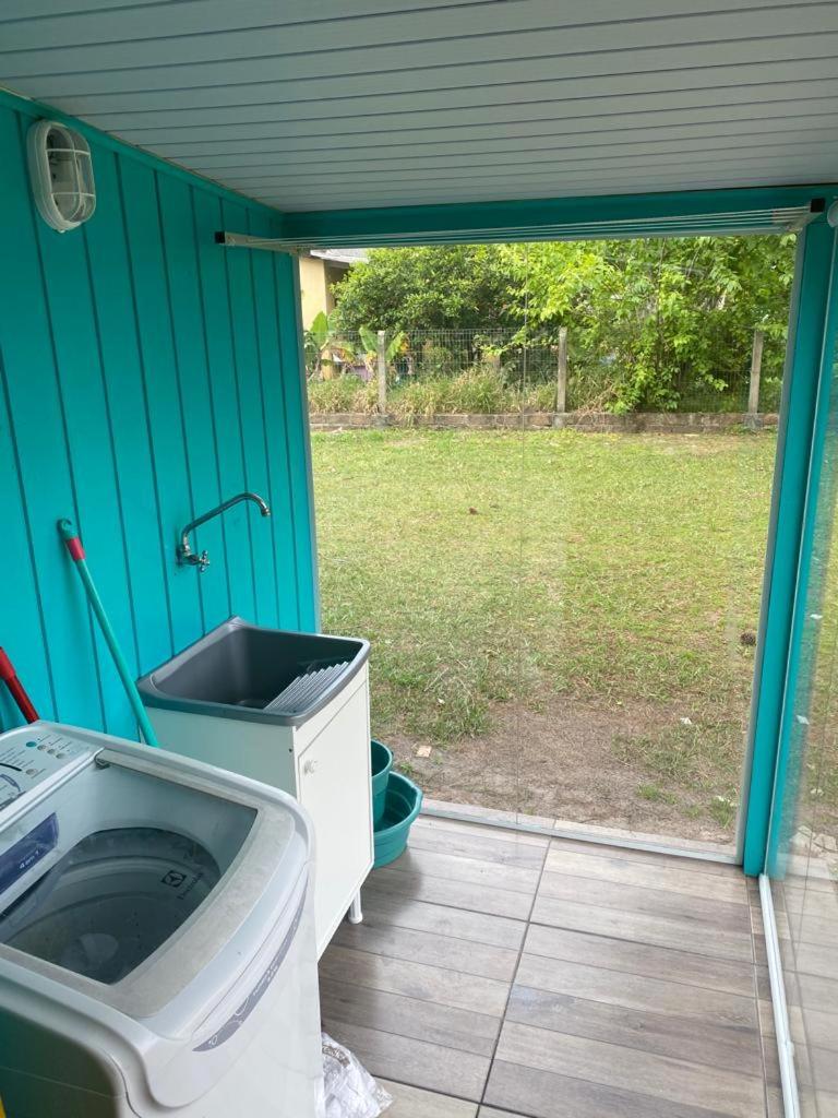 Casa com piscina e salão de jogos para aluguel de temporada e finais de semana em Torres/RS.