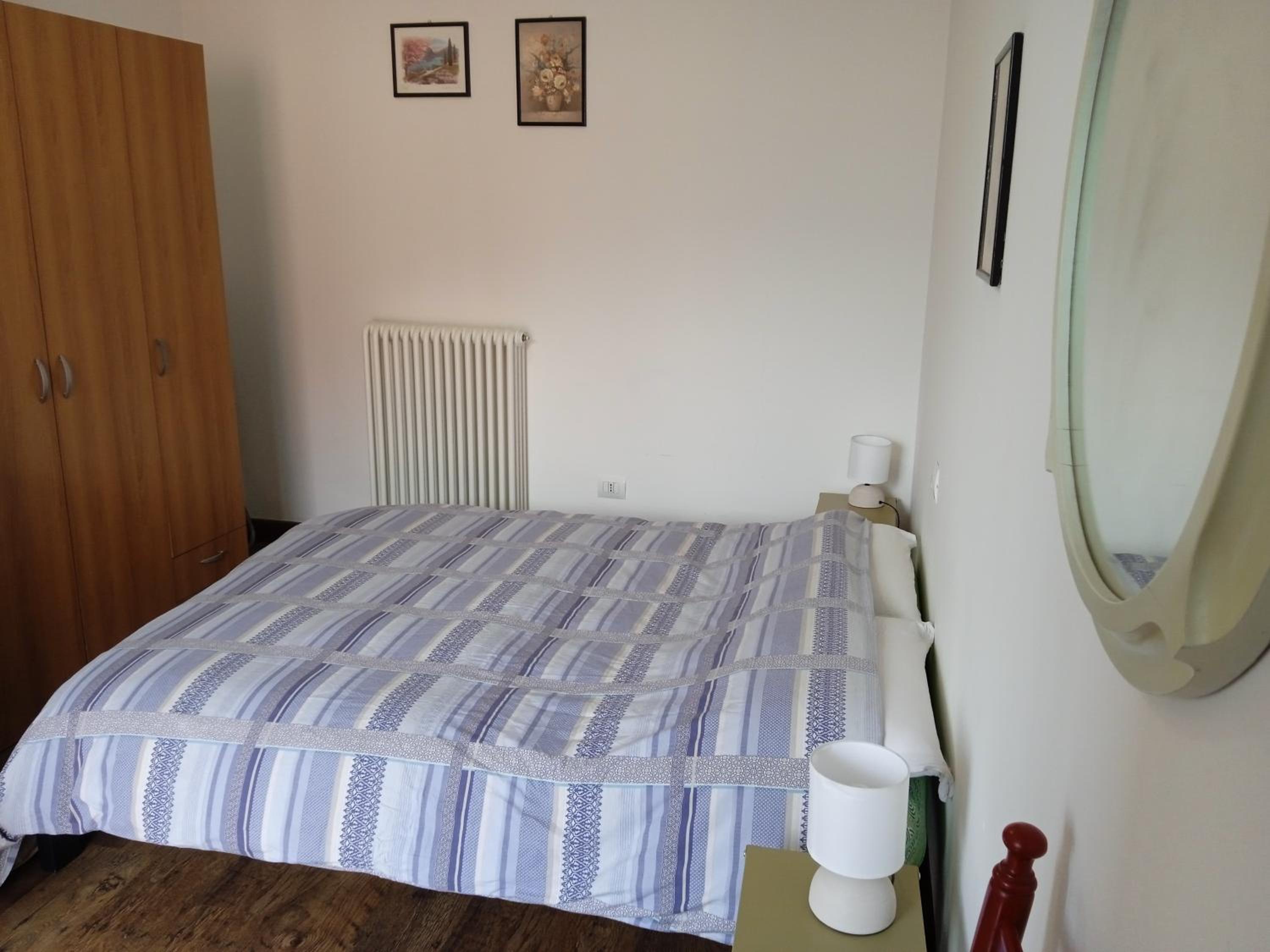 Appartamento Primo Sole en Primaluna — bedroom