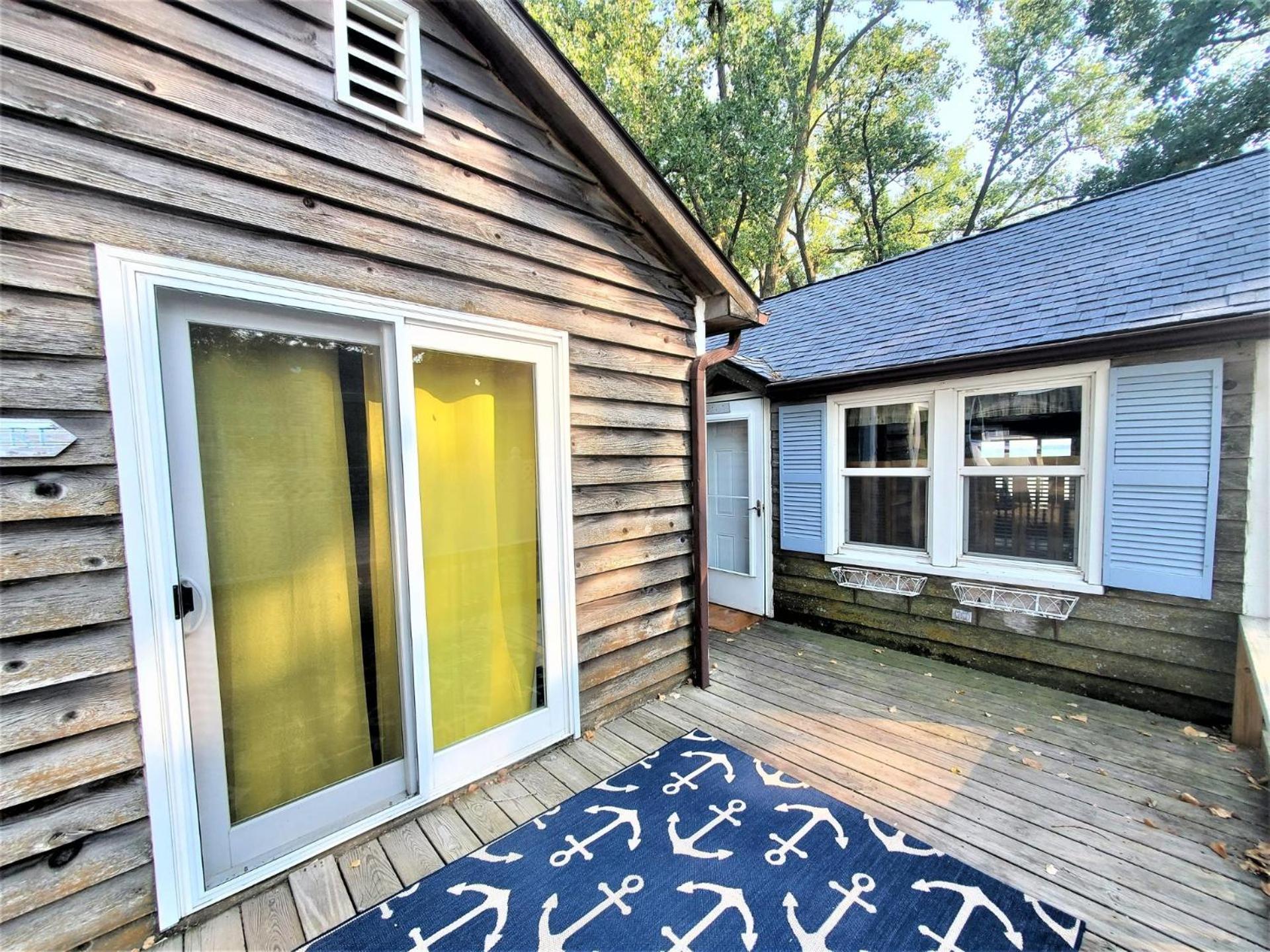 Classic West Lake Okoboji Estate w/ Guest House + Sand Beach