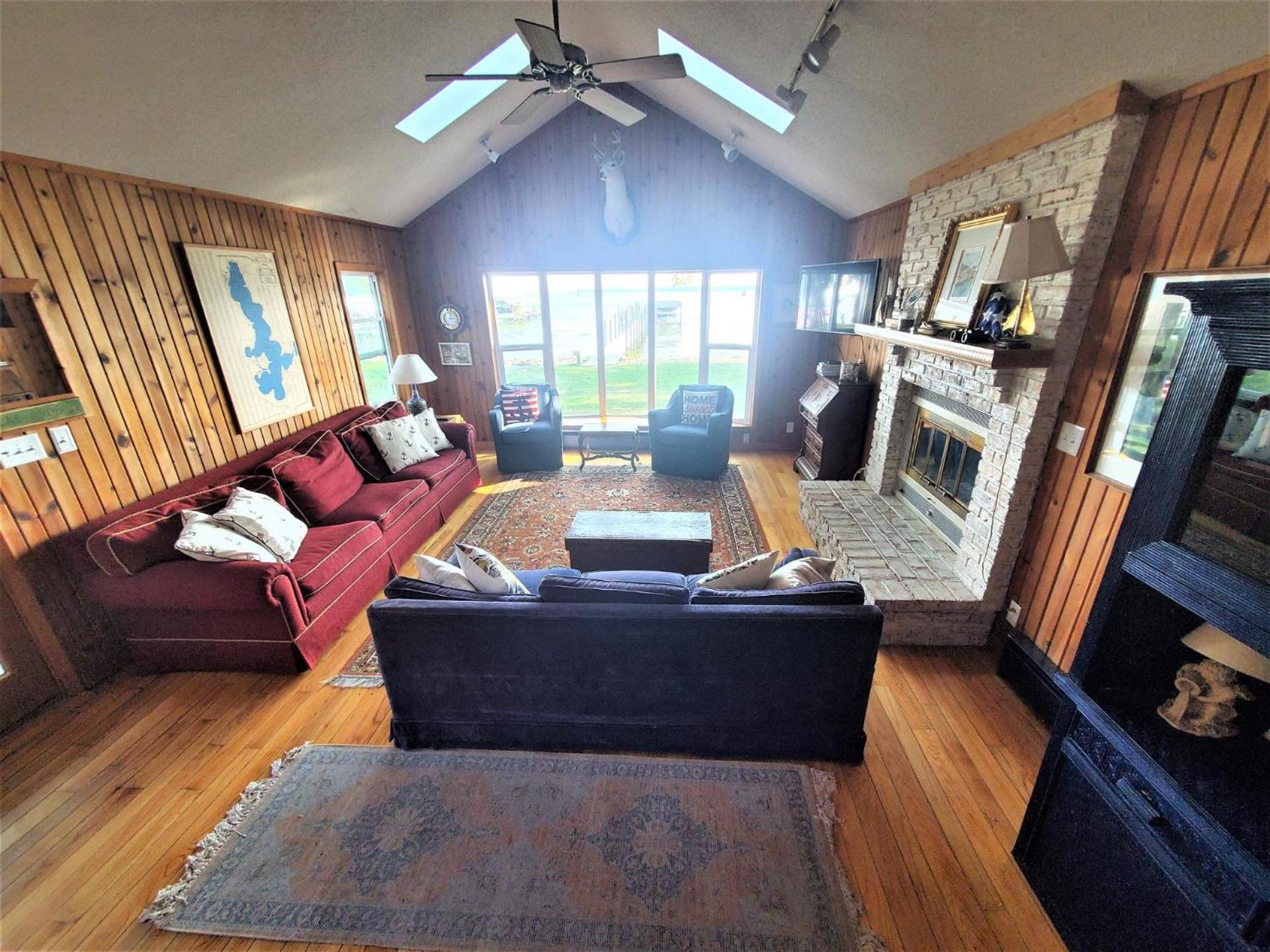 Classic West Lake Okoboji Estate w/ Guest House + Sand Beach
