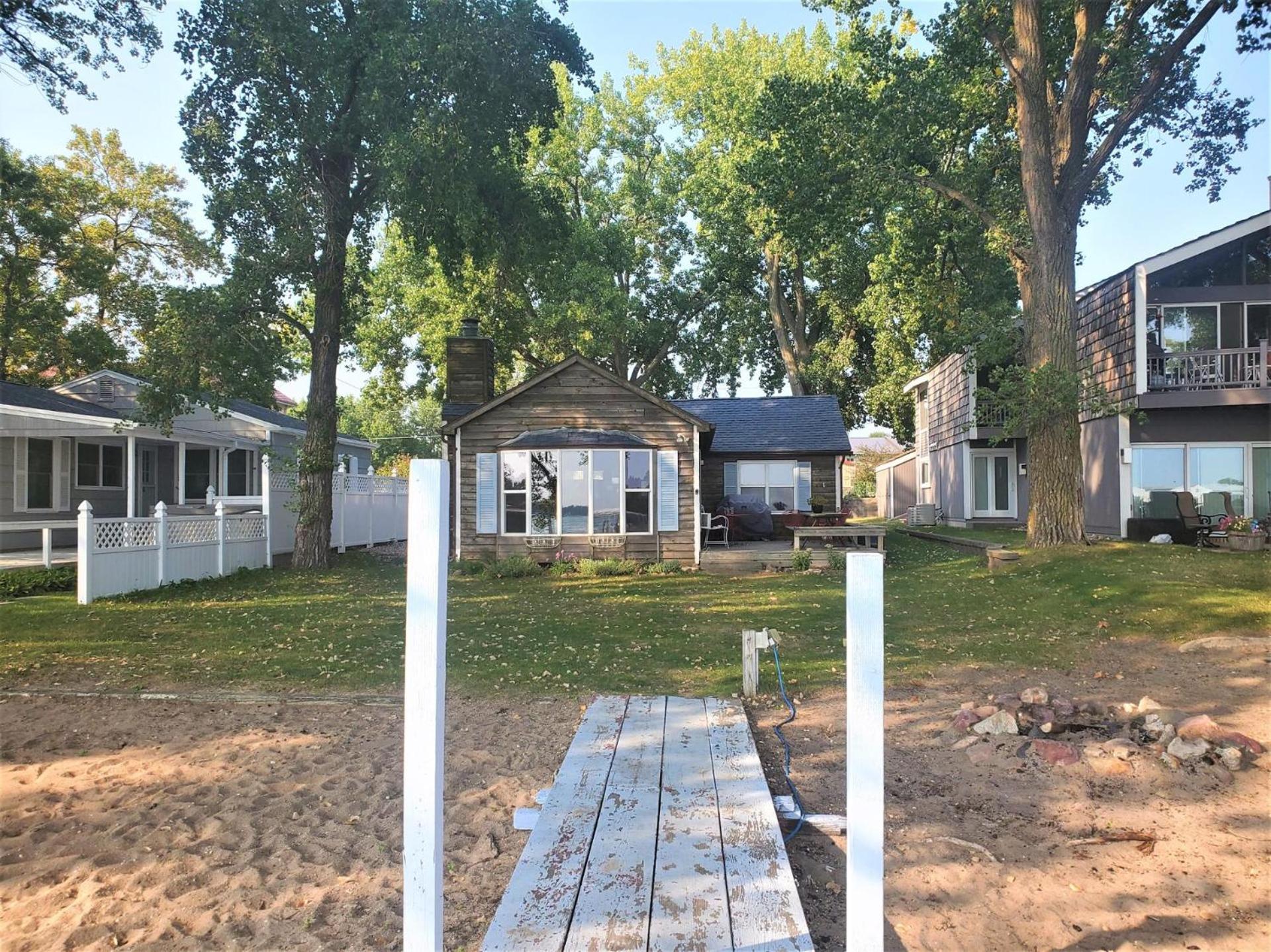 Classic West Lake Okoboji Estate w/ Guest House + Sand Beach