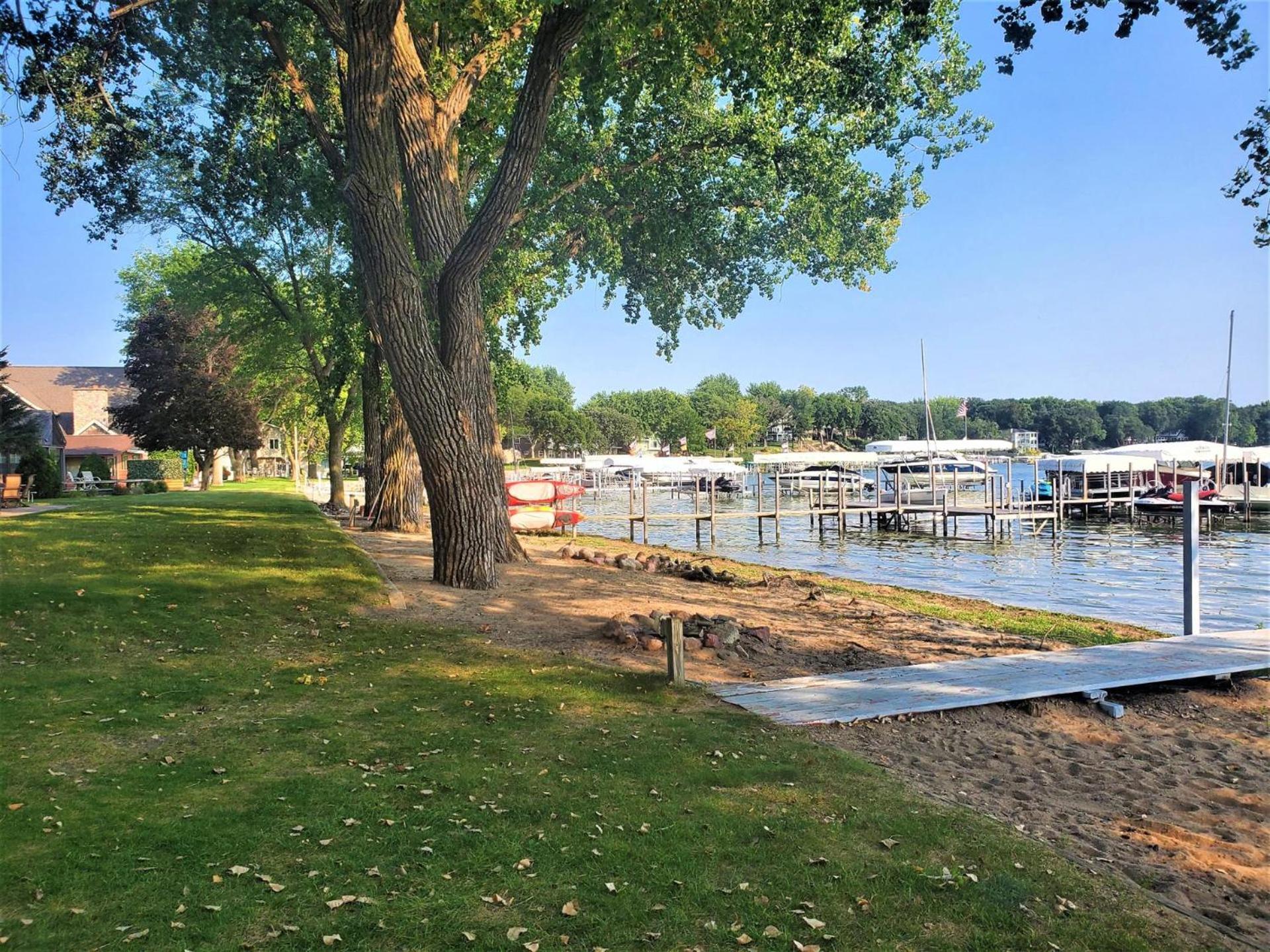 Classic West Lake Okoboji Estate w/ Guest House + Sand Beach