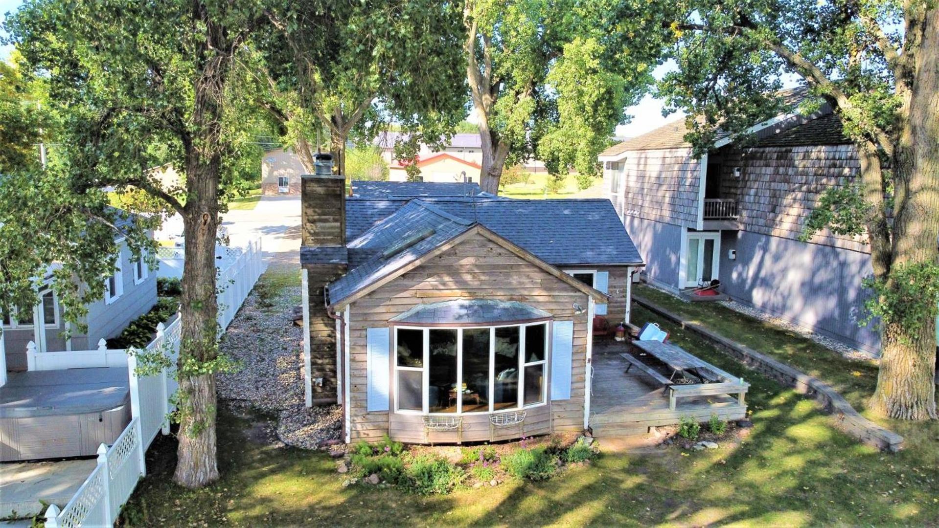 Classic West Lake Okoboji Estate w/ Guest House + Sand Beach