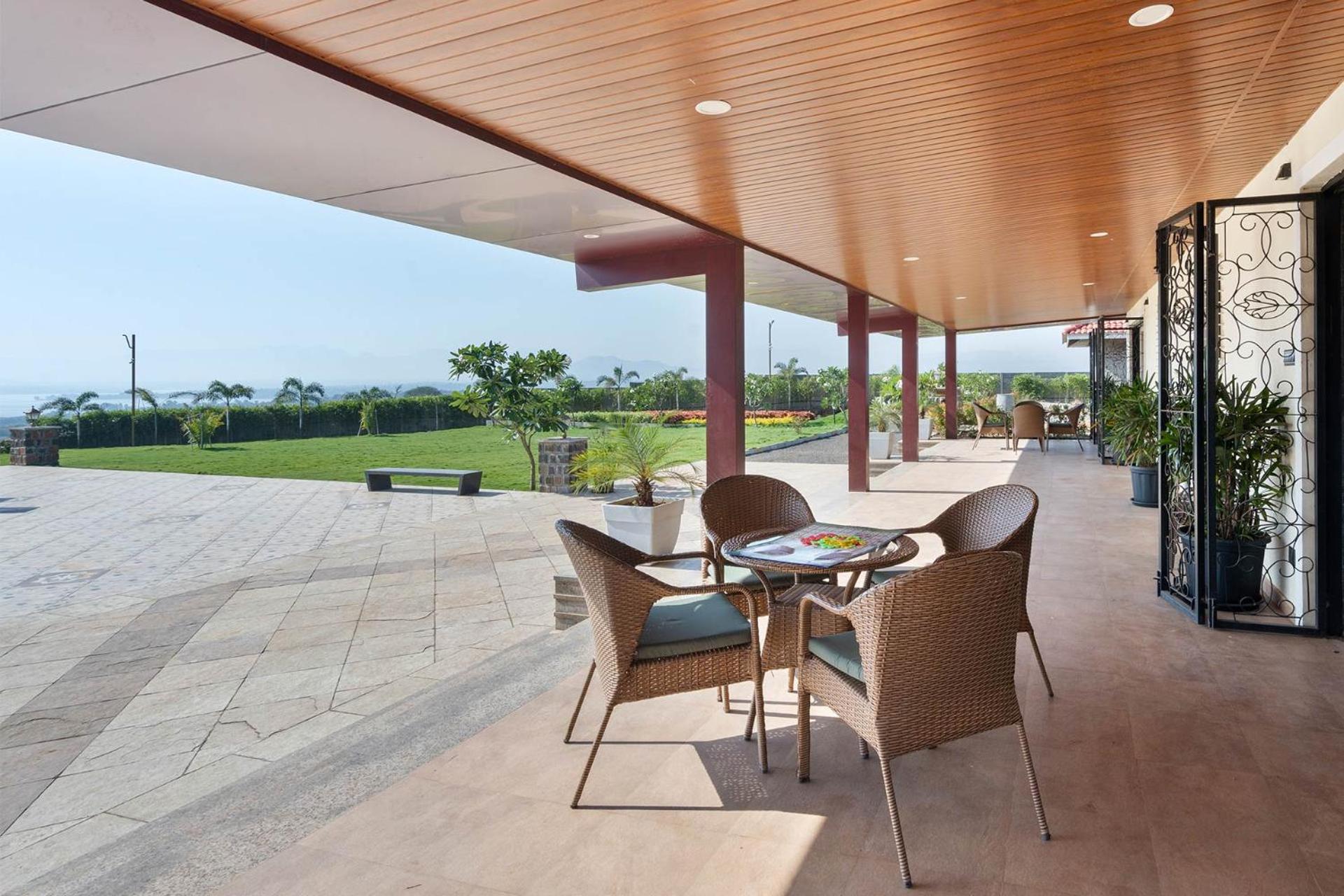 Breezy Whispers by StayVista - Private infinity pool, Stunning mountain views, Spacious swimming pool, Deck & Lawn view 2