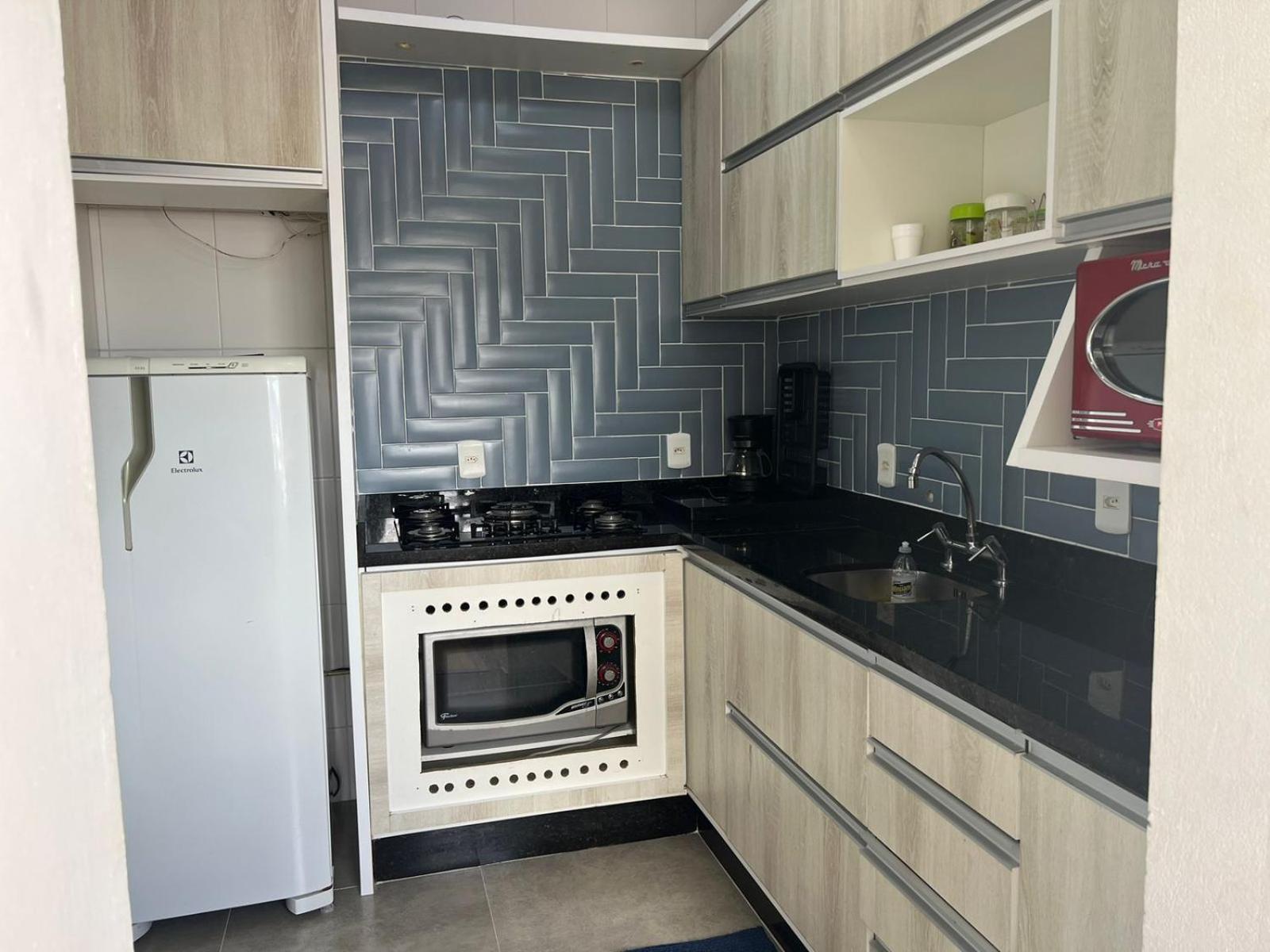 Lindo apartamento completo e com garagem coberta