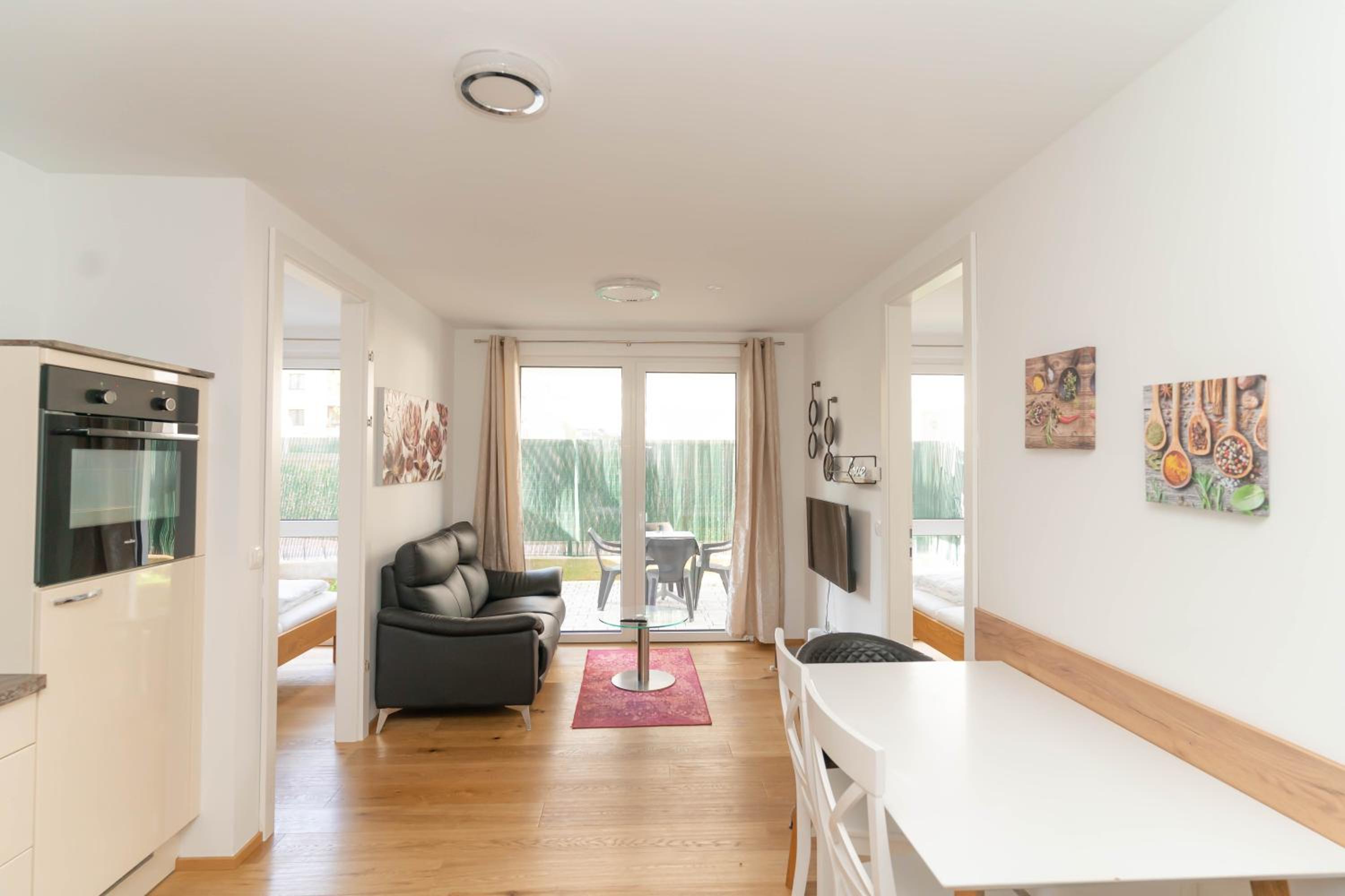 Modern apartment with tiny garden near city center