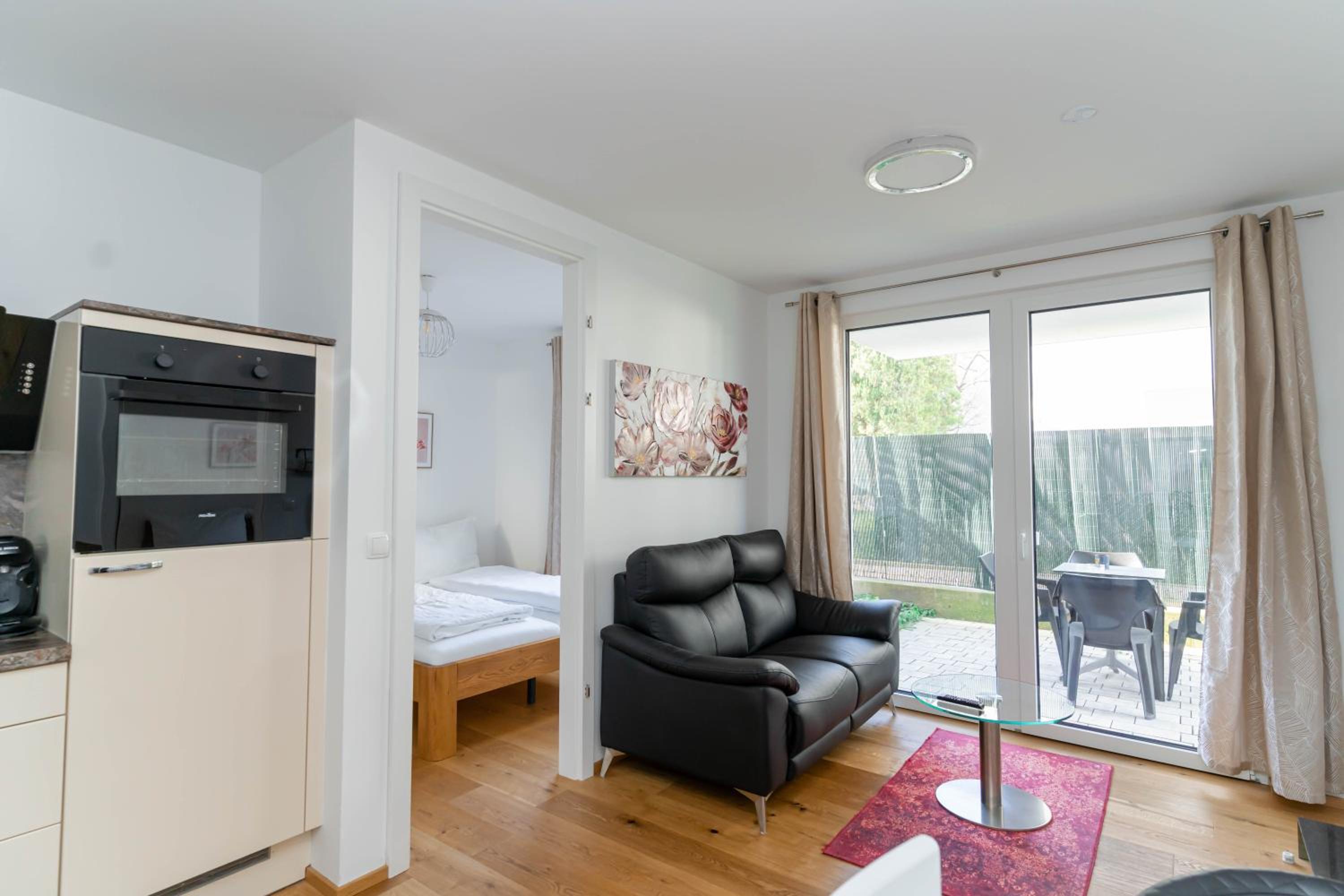 Modern apartment with tiny garden near city center