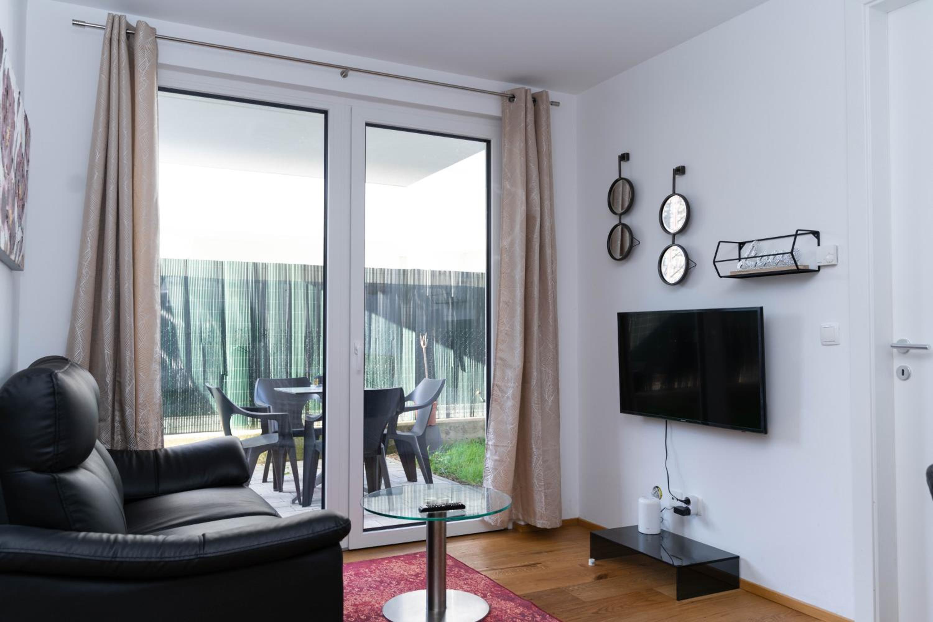 Modern apartment with tiny garden near city center