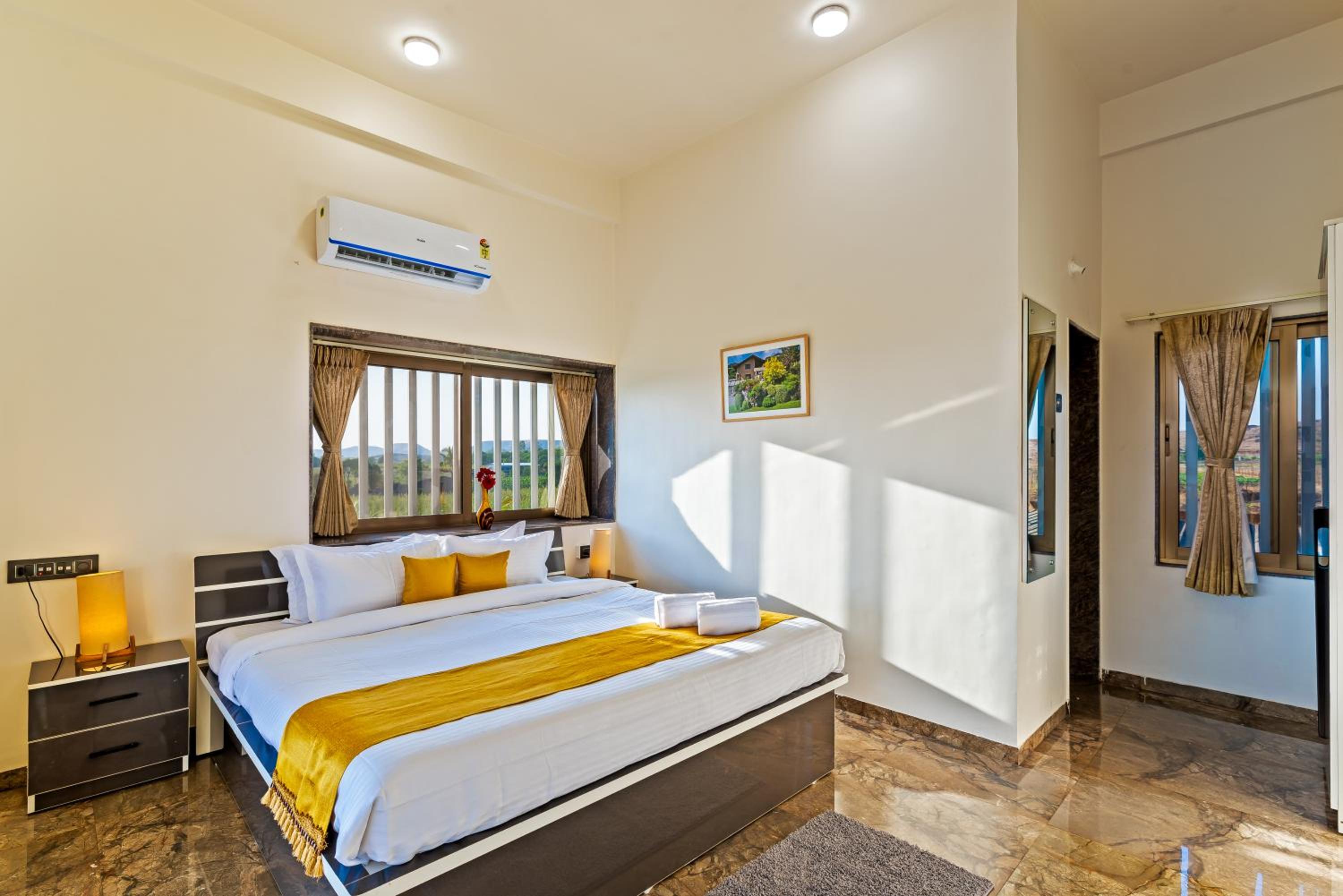SaffronStays Mango Lakeview Villa - 3BR pool villa amid mango farms with Gangapur Dam views, deck & games view 5