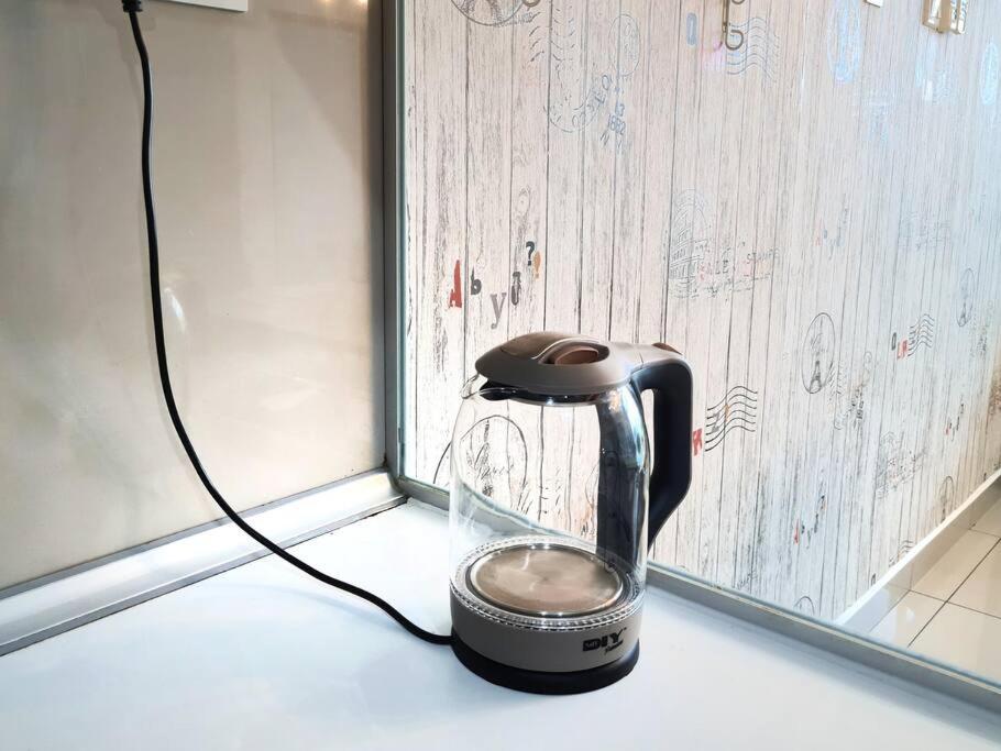 Palazio 3 bedroom balcony lake view high floor by GDRAGON HomeStay