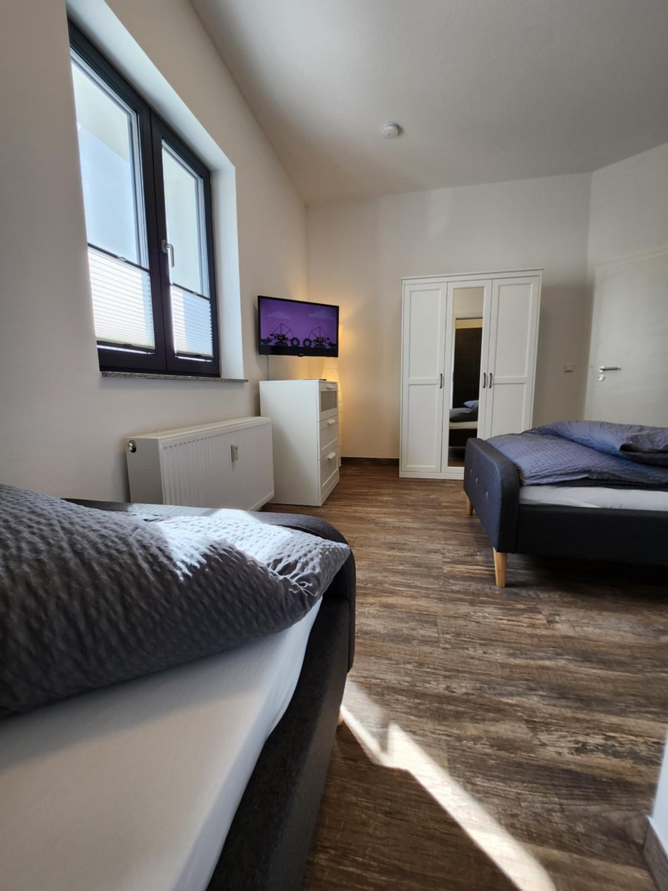 BIELEFELD CITY APARTMENTS - komfortable Einzelzimmer und Doppelzimmer - moderne Badezimmer, schnelles WLAN, Self-Check-In