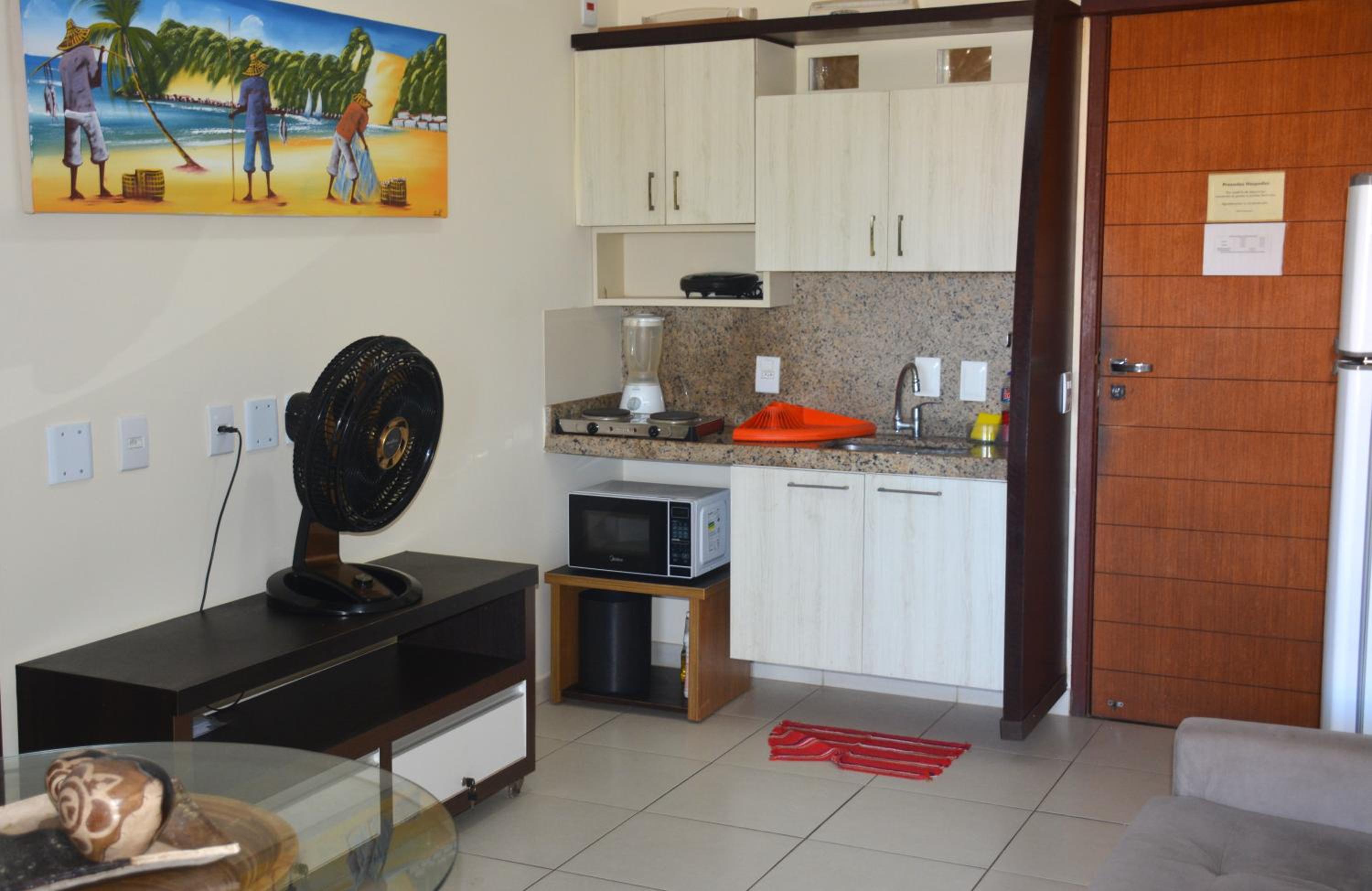 Na praia - Elegance 402 Luxo - Lateral vista mar