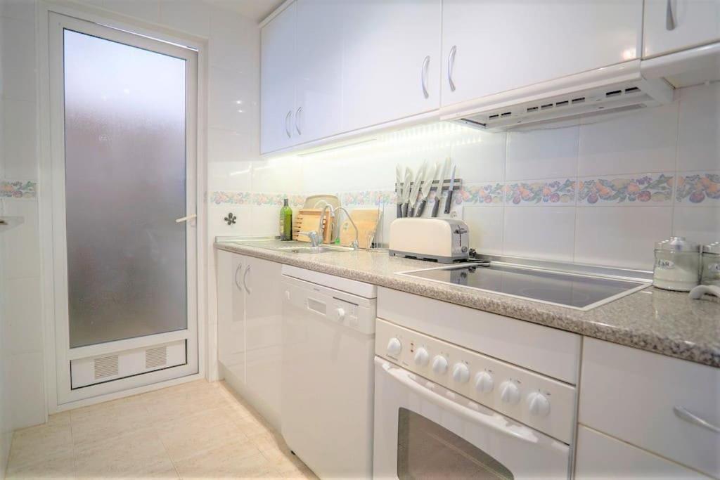 Spacious ground floor apartment overlooking the beautiful communal pool