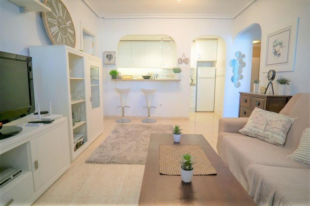 Spacious ground floor apartment overlooking the beautiful communal pool