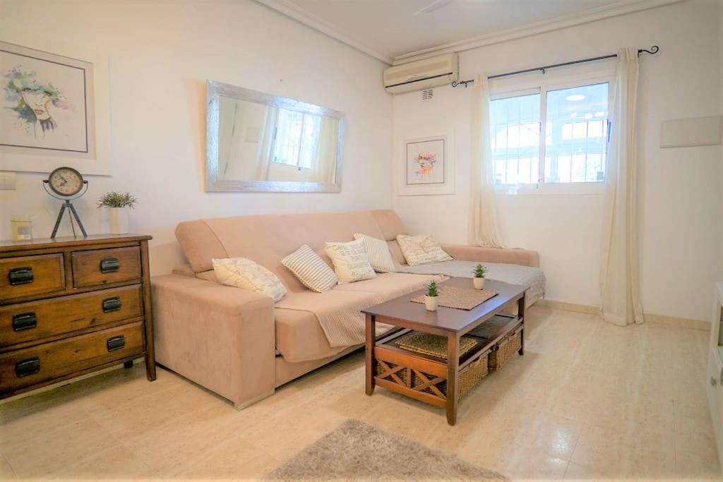 Spacious ground floor apartment overlooking the beautiful communal pool