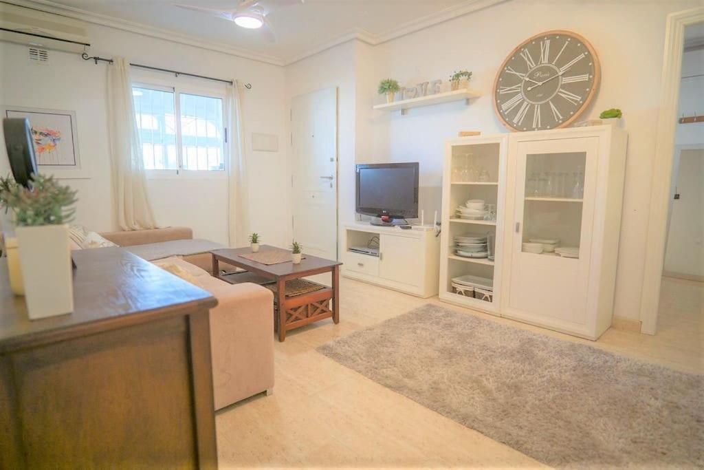 Spacious ground floor apartment overlooking the beautiful communal pool