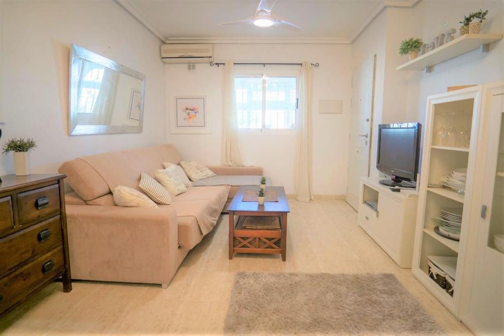 Spacious ground floor apartment overlooking the beautiful communal pool