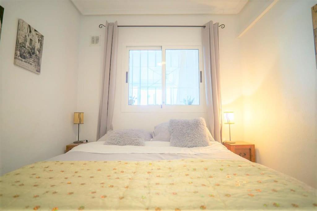 Spacious ground floor apartment overlooking the beautiful communal pool