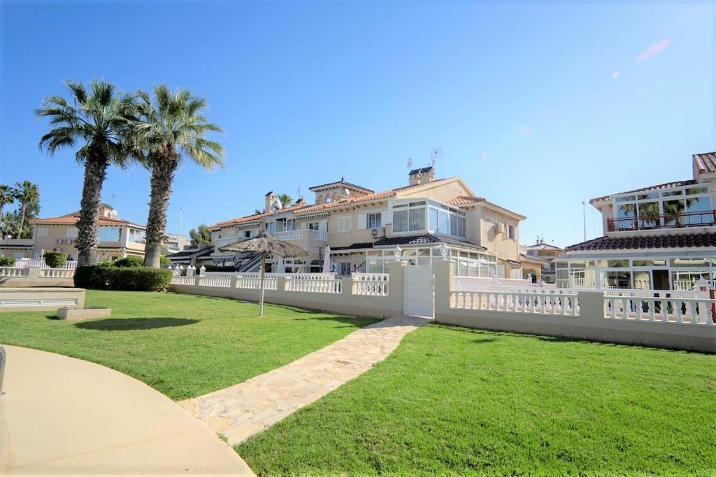 Spacious ground floor apartment overlooking the beautiful communal pool