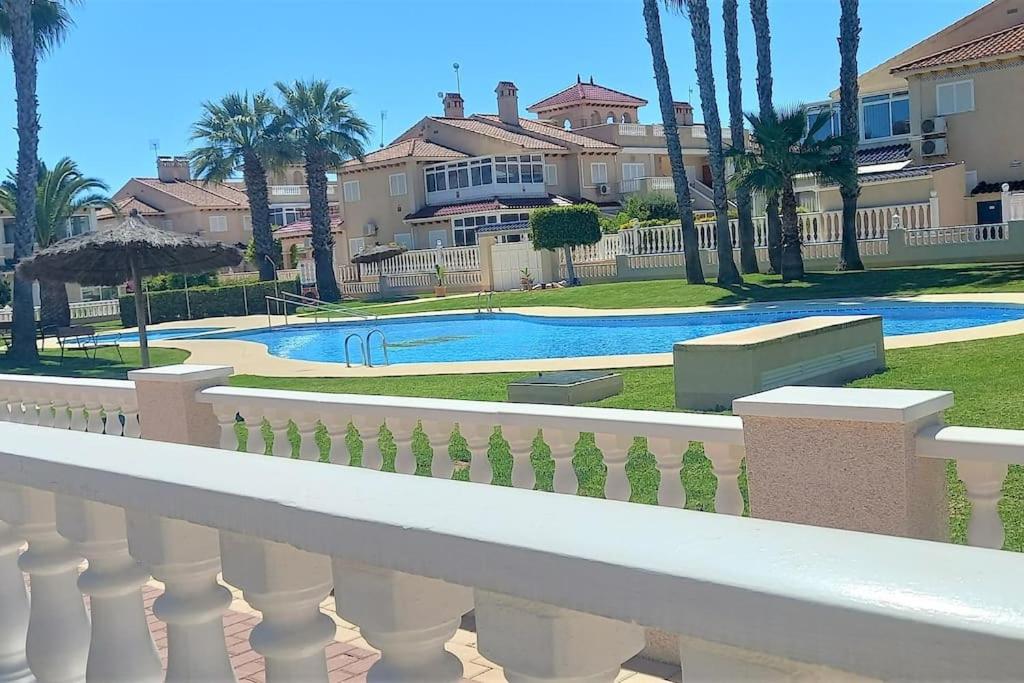 Spacious ground floor apartment overlooking the beautiful communal pool