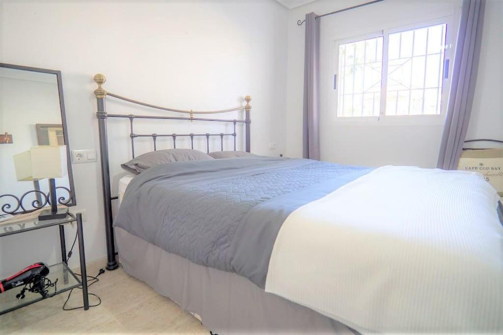 Spacious ground floor apartment overlooking the beautiful communal pool