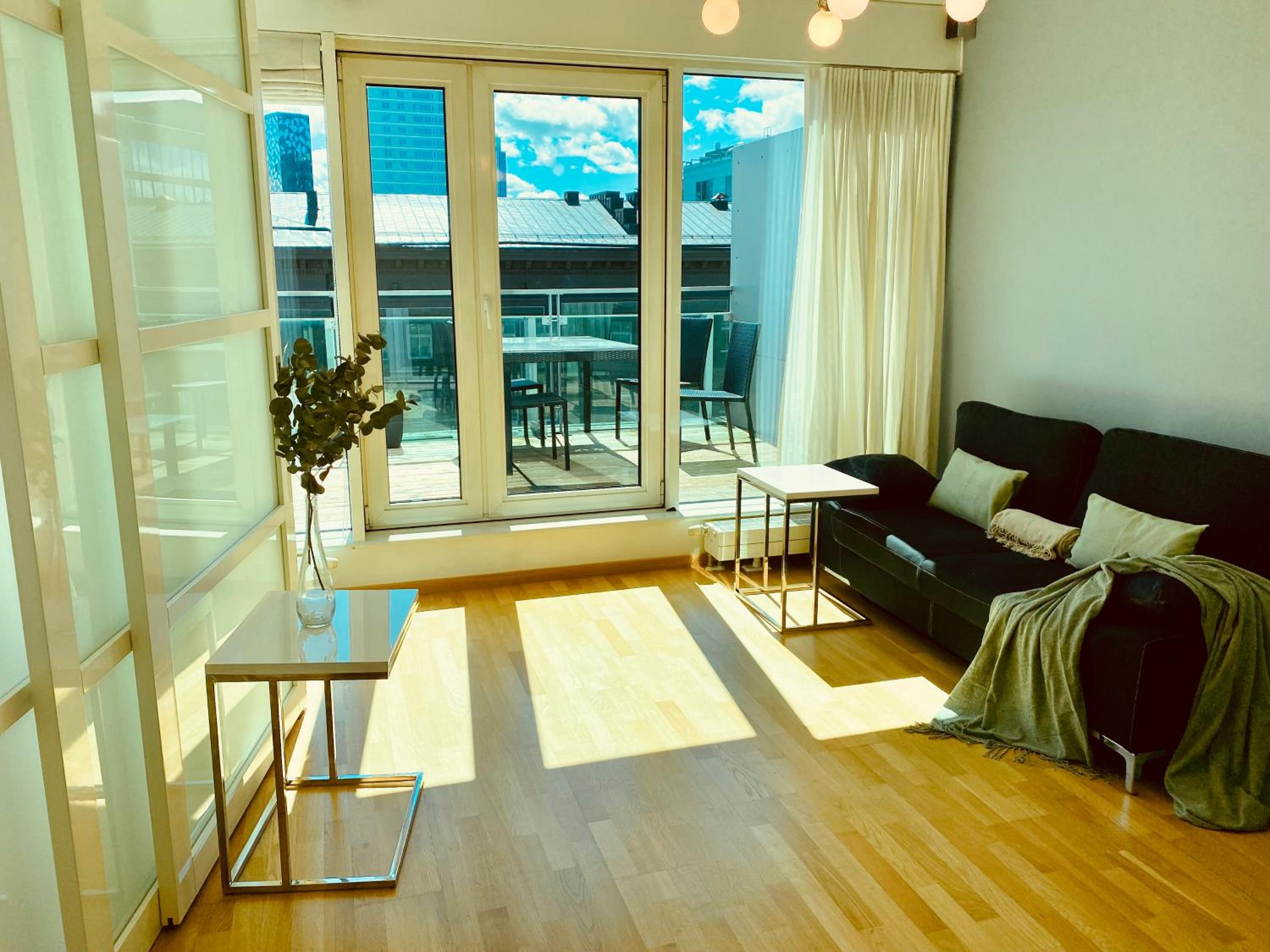City Heart Apartment with a Sunny Rooftop Terrace