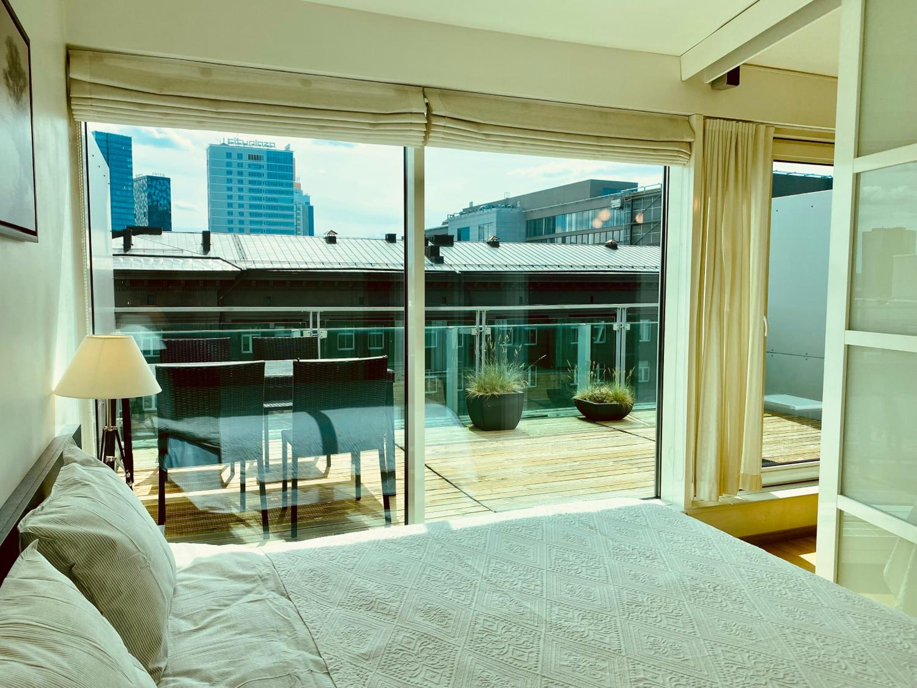City Heart Apartment with a Sunny Rooftop Terrace