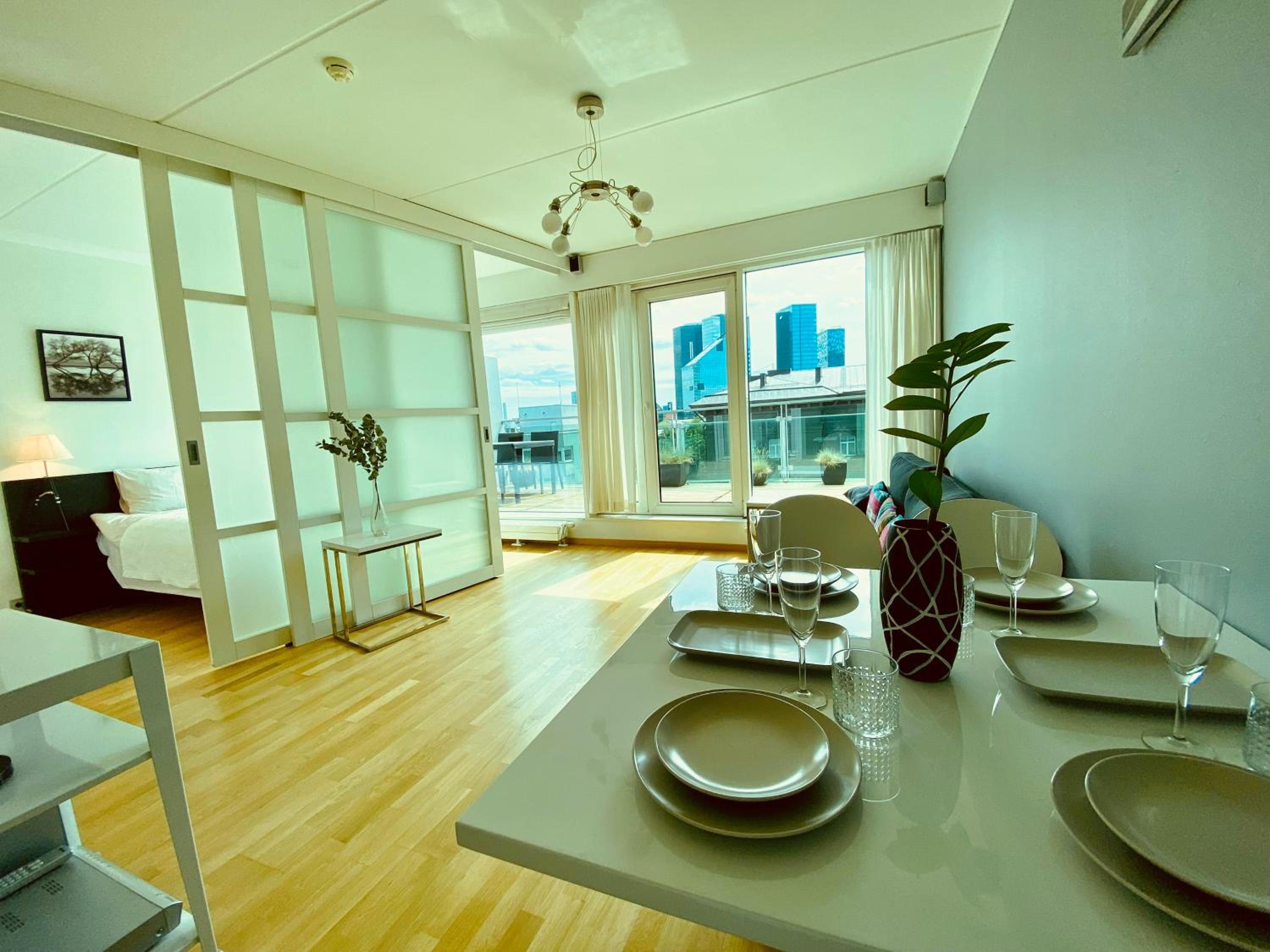 City Heart Apartment with a Sunny Rooftop Terrace