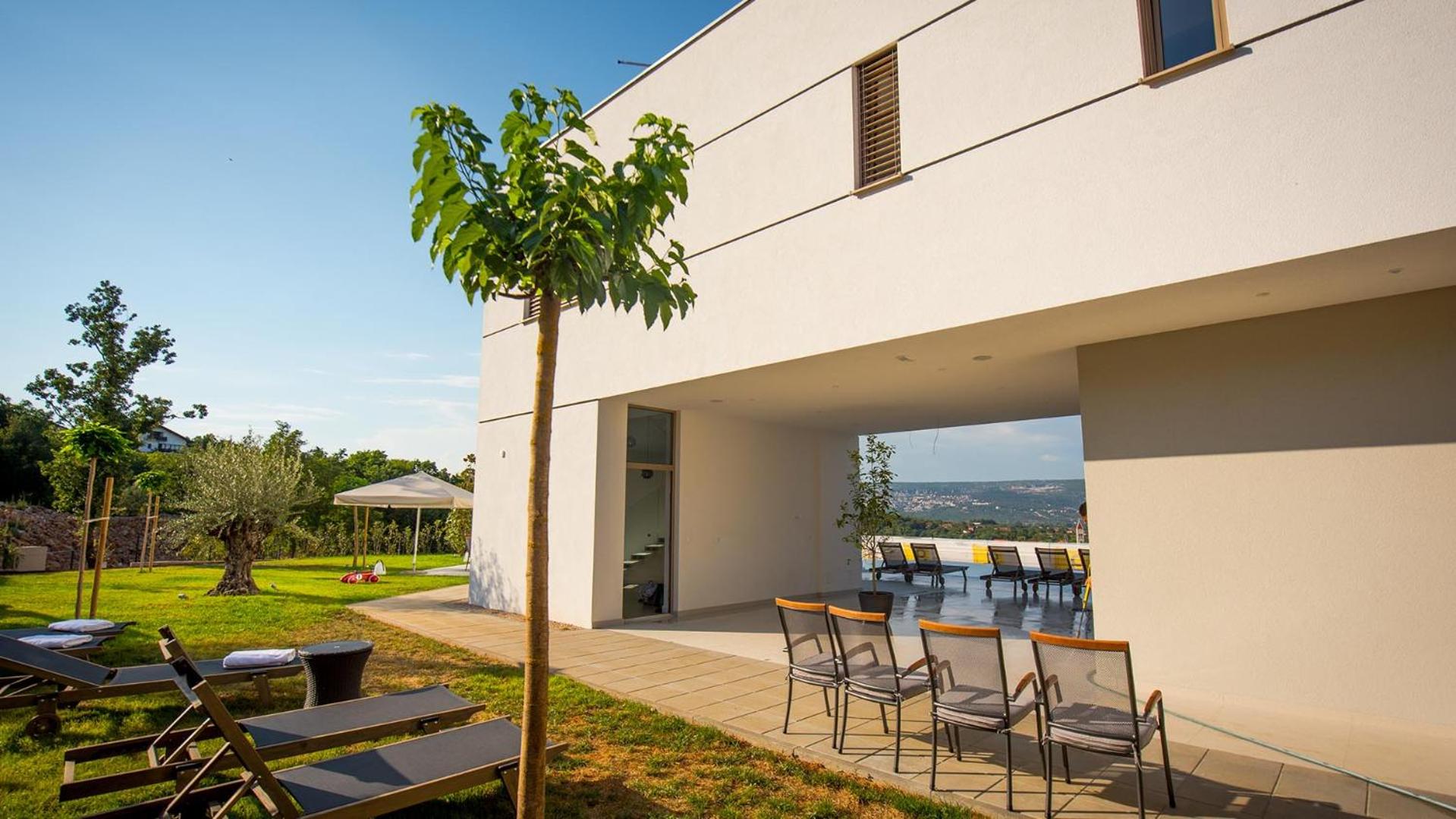 A modern villa in Zmijavci with a gym, tennis and basketball court view 4