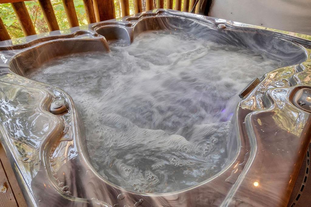 Gorgeous Idyllic Cabin w Hot Tub and Fire Pit Quittin Time is Secluded Romantic Oasis w Luxury Bathroom Double Shower and Bathtub Foosball Table view 4
