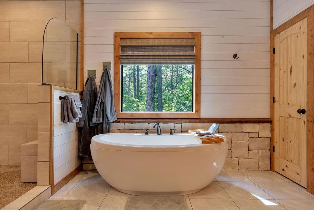 Gorgeous Idyllic Cabin w Hot Tub and Fire Pit Quittin Time is Secluded Romantic Oasis w Luxury Bathroom Double Shower and Bathtub Foosball Table view 3