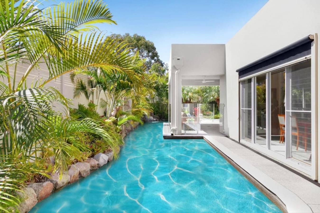 Luxury resort style villa pool by Custom Bnb Hosting