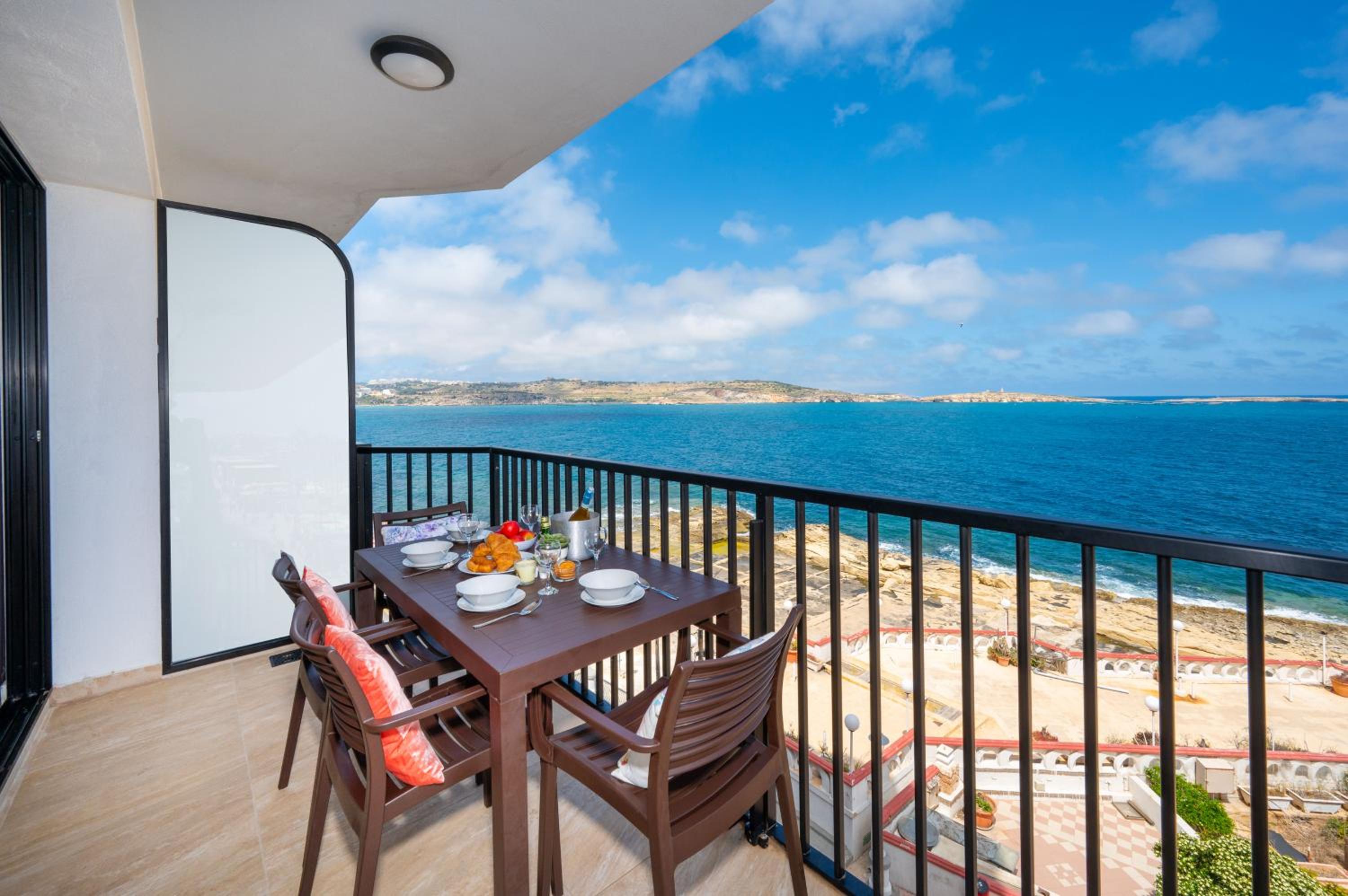 Islet Promenade Seafront Apartment with large Corner Terrace by Getawaysmalta photo 2