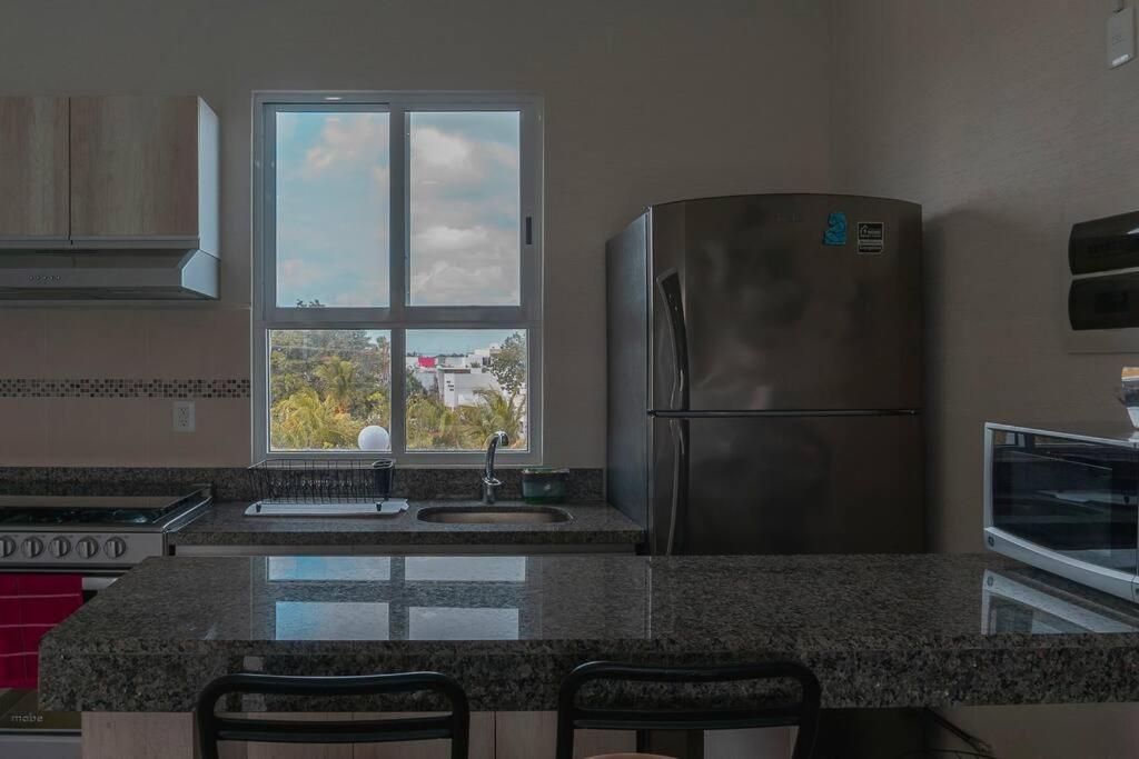 DR02 Departamento Moderno con Vista a la Laguna en Dream Lagoons
