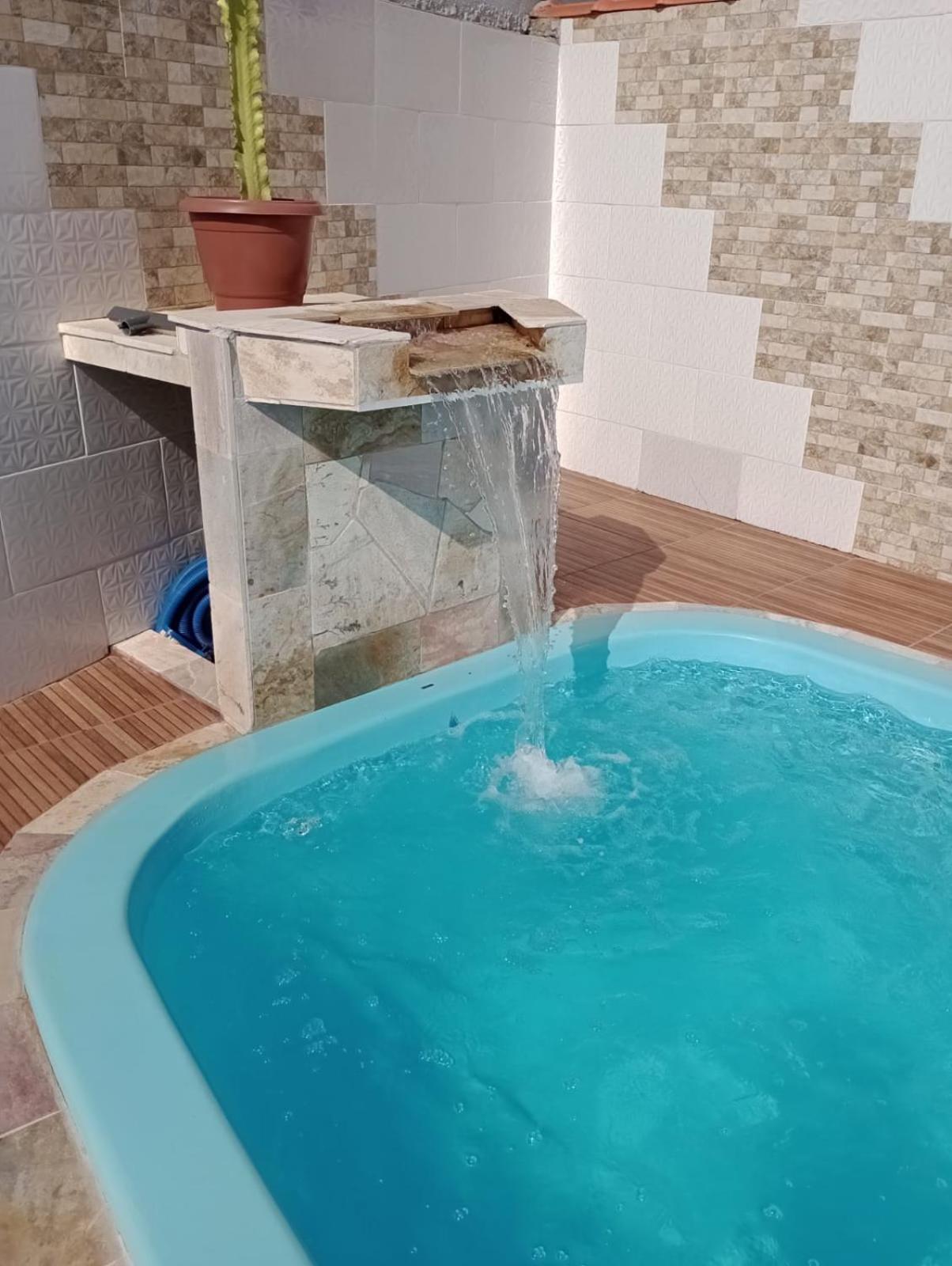 Casa na praia com piscina e churrasqueira