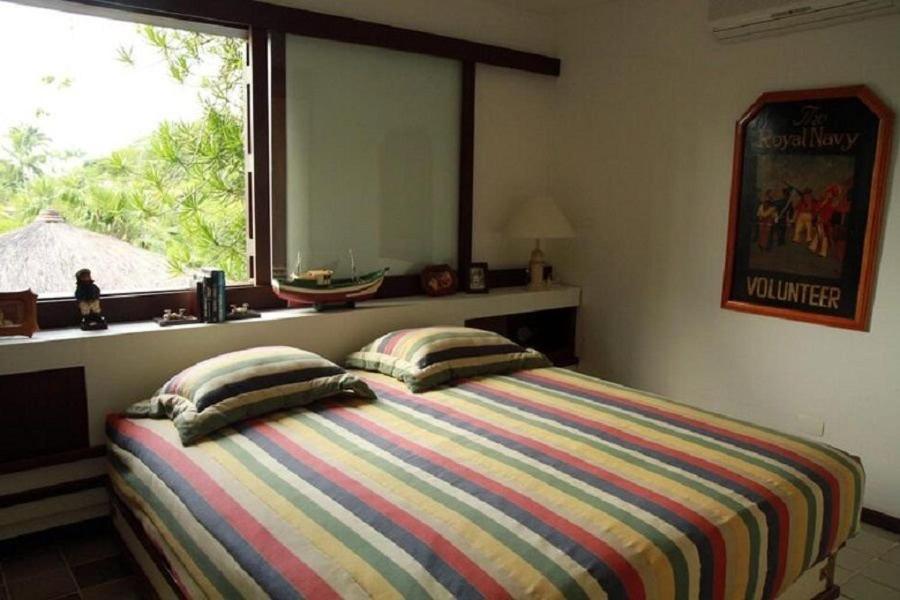 SMI012 Casa charmosa em condomínio à beira mar